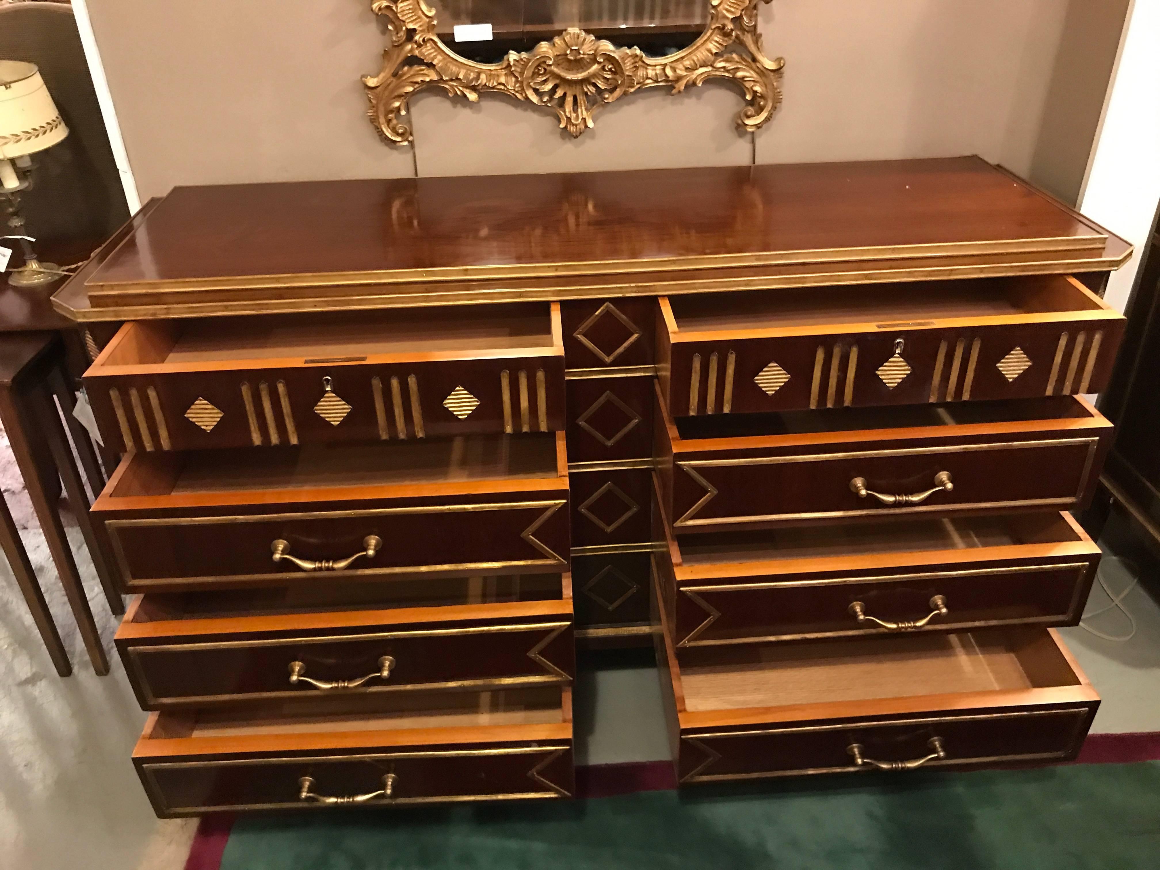 A palatial pair of Russian neoclassical style chests or commodes with step up tops. This spectacular oversized pair of recently polished commodes have all the style and flare anyone could possibly wish for. The center bronze diamond design flanked