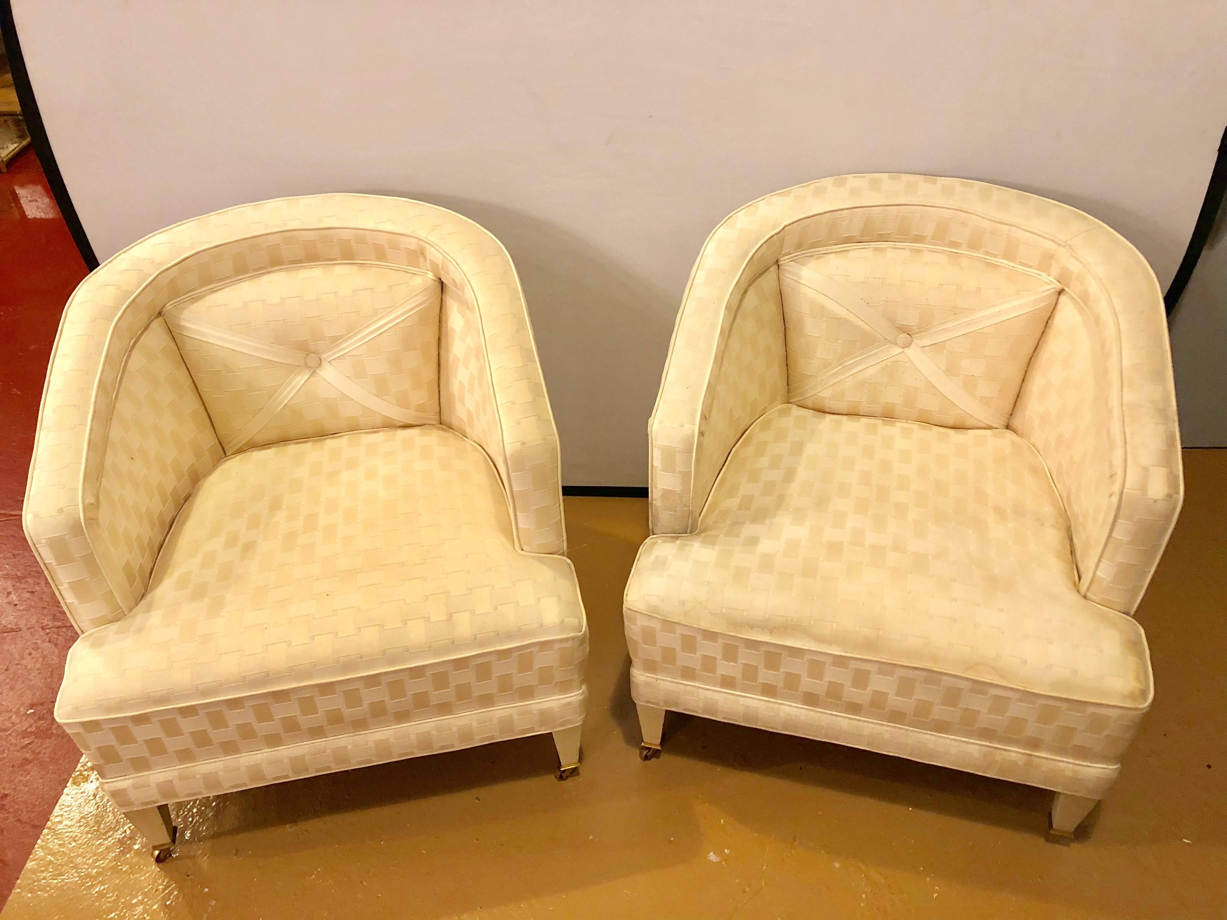 Pair of Dorothy Draper style lounge chairs. Each on brass sabots leading to tapering paint decorated frames. The chairs in a very fine and decorative style and fabric depicting the Hollywood Regency era to it finest level. The back having a finely
