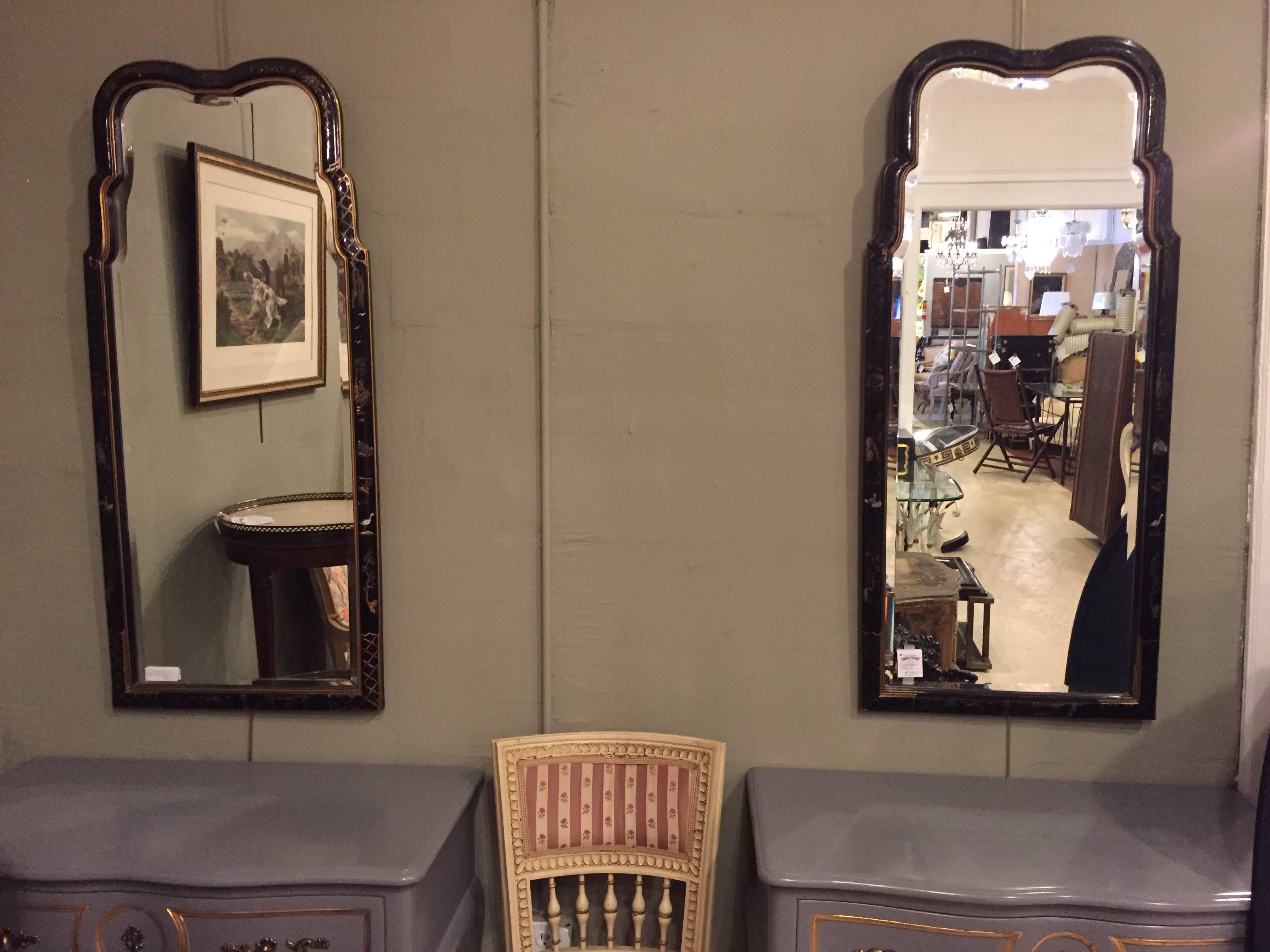 A pair of Drexal chinoiserie decorated console or pier wall mirrors. Each having a clear bevelled mirror in a stork decorated chinoiserie wooden frame.