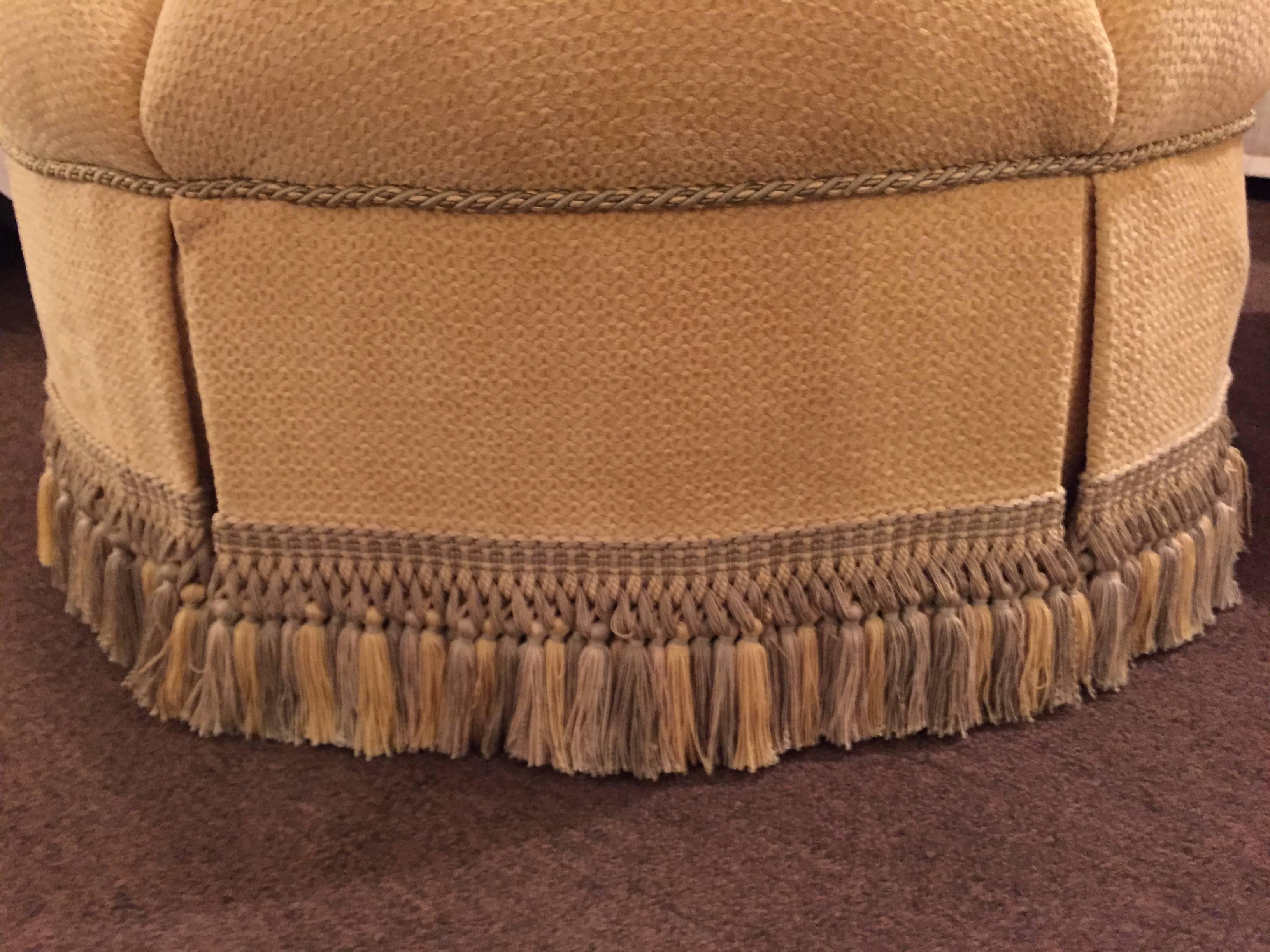 Art Deco Circular Finely Upholstered and Lined Ottoman or Poof with a Tassel Fringe Base