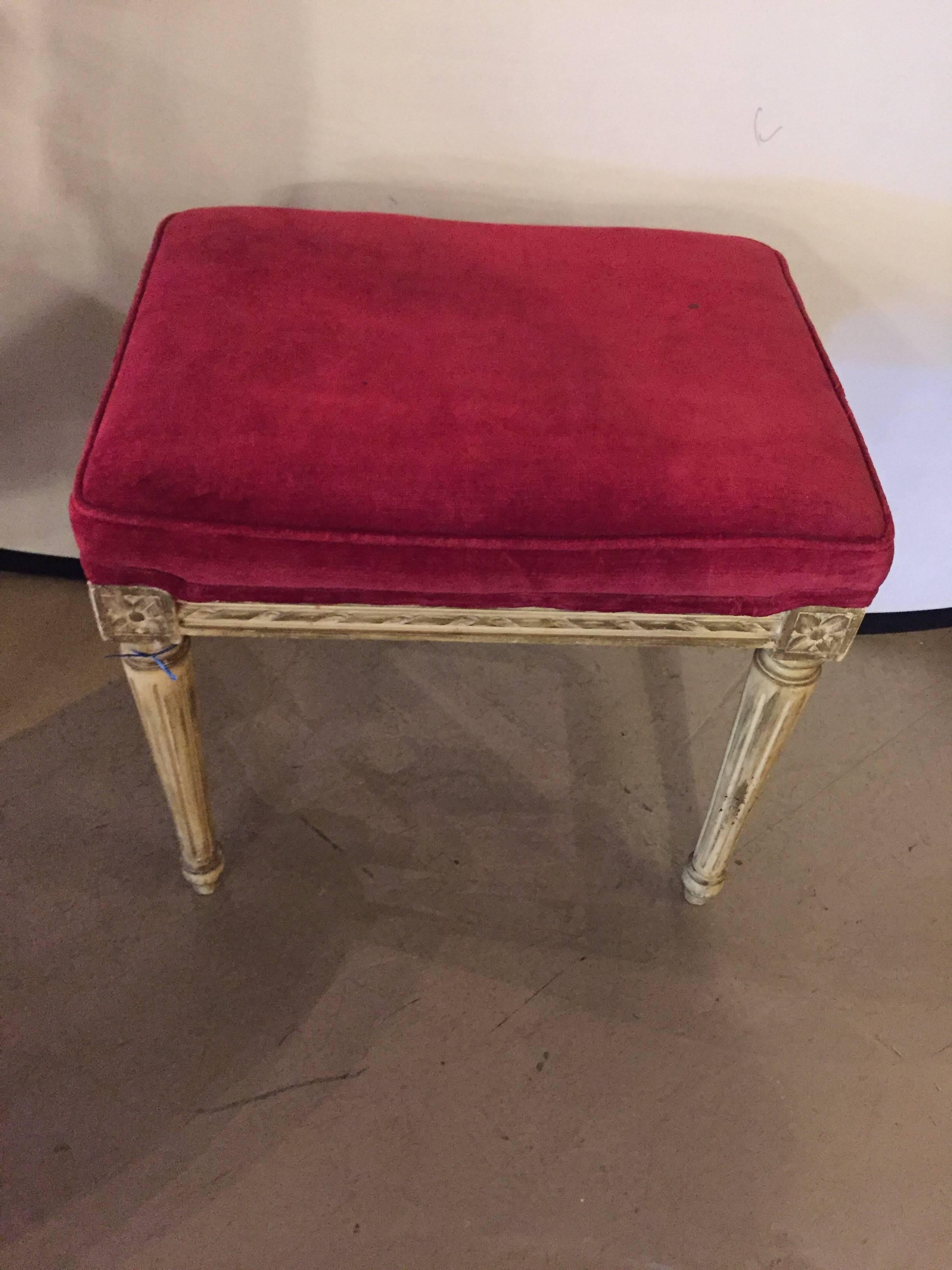Distressed painted stool with velvet upholstery. Off-white distressed finish on Louis XVI reeded legs.