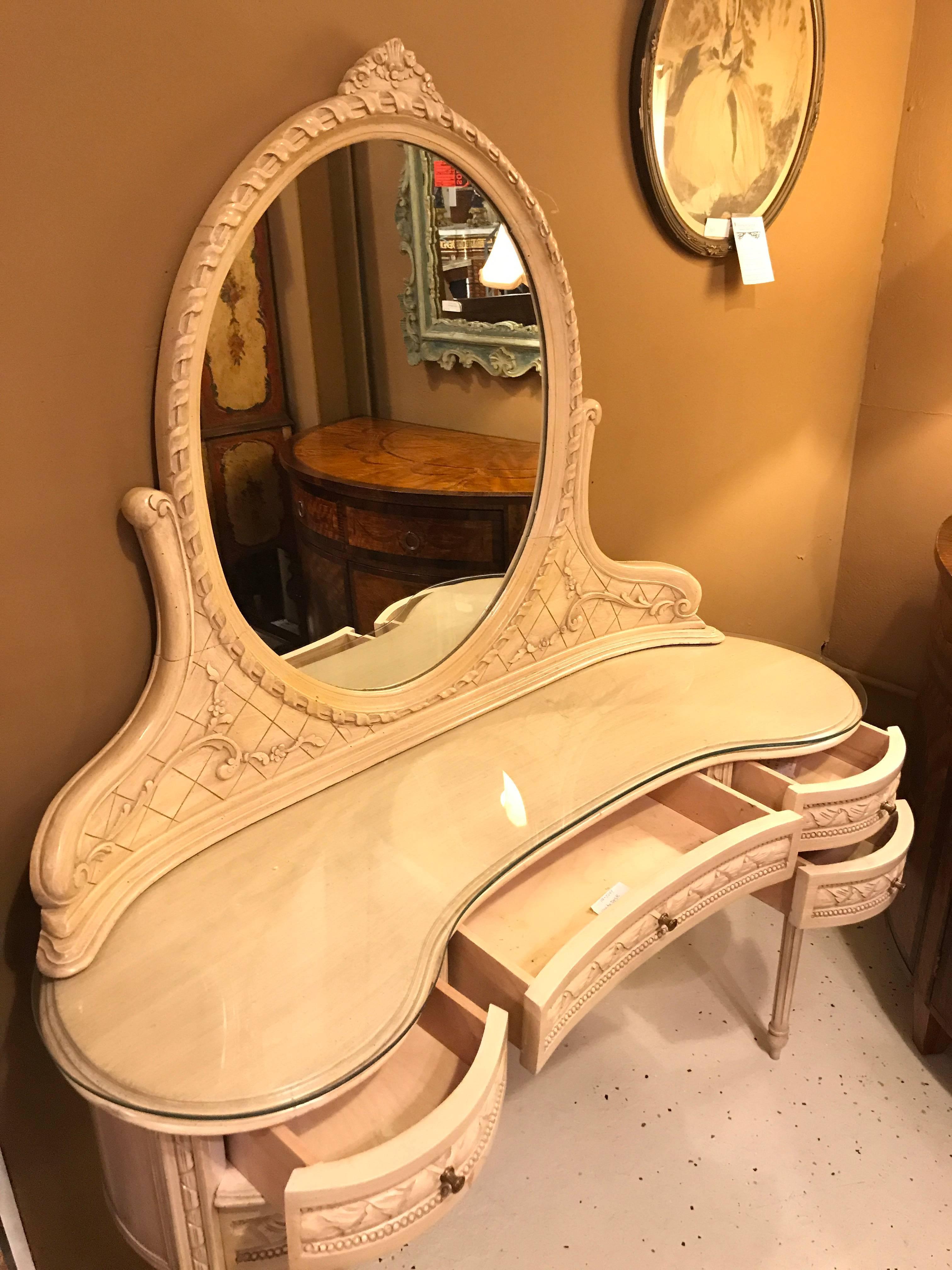 vanity with mirror and chair