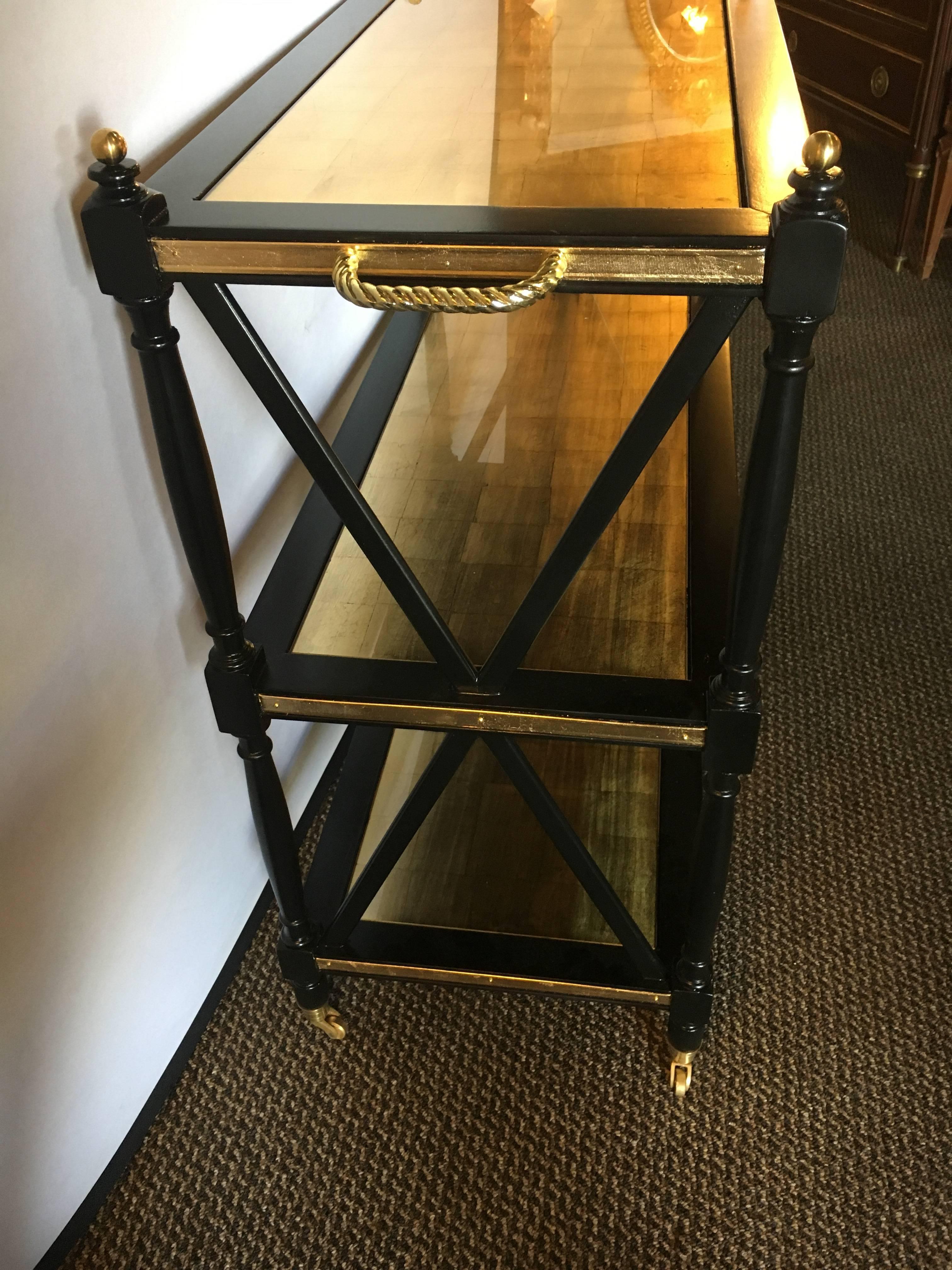 A Pair Ebony Gilt Glass Bronze Mounted Jansen Style Tea Serving Carts /  Wagons In Good Condition In Stamford, CT