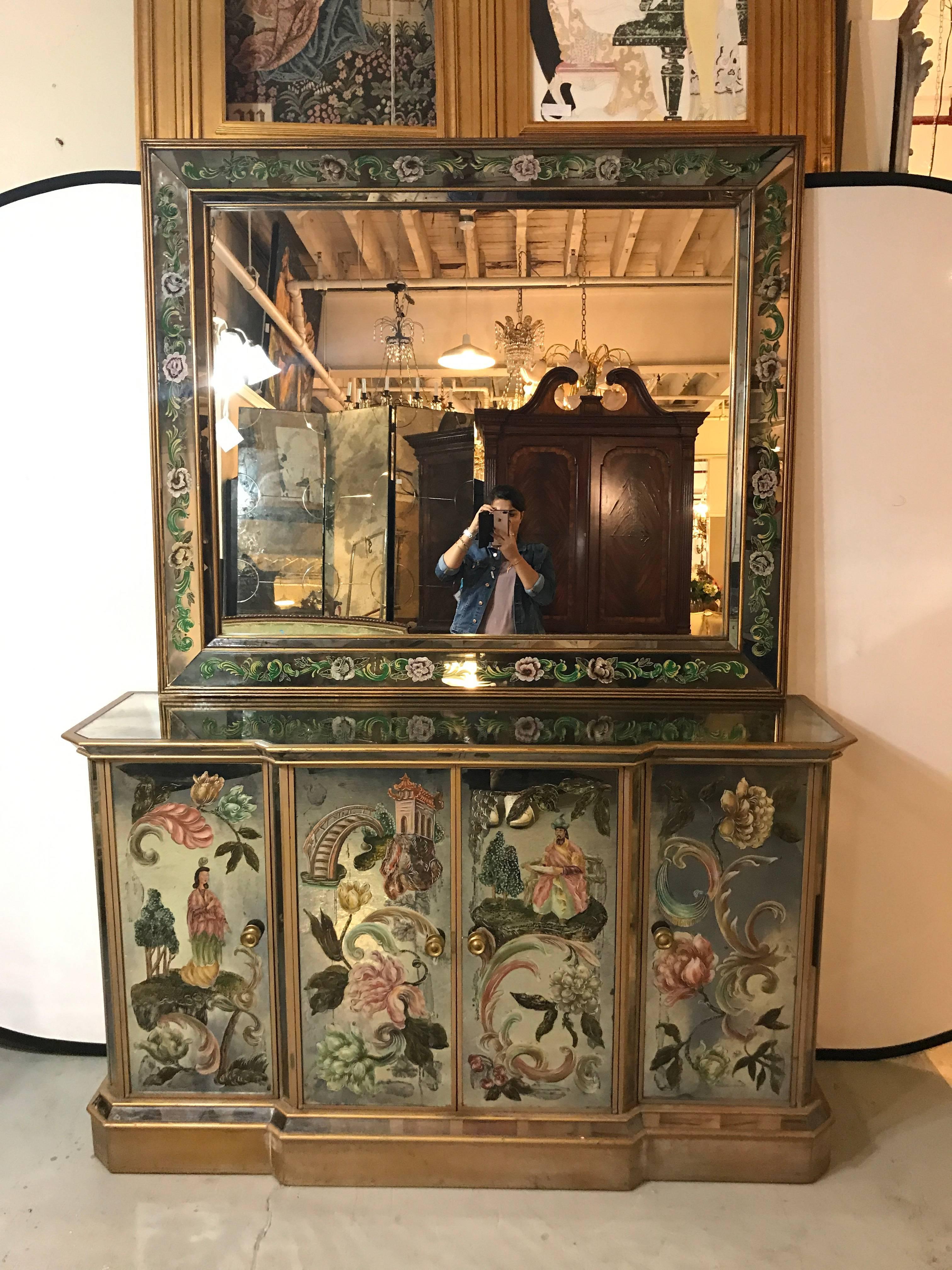 An Italian reverse paint decorated Hollywood Regency over the mantel or console wall mirror. The matching console or sideboard is sold separately. This fine custom quality center mirror has a shadow box angled mirror frame which is overshadowed by