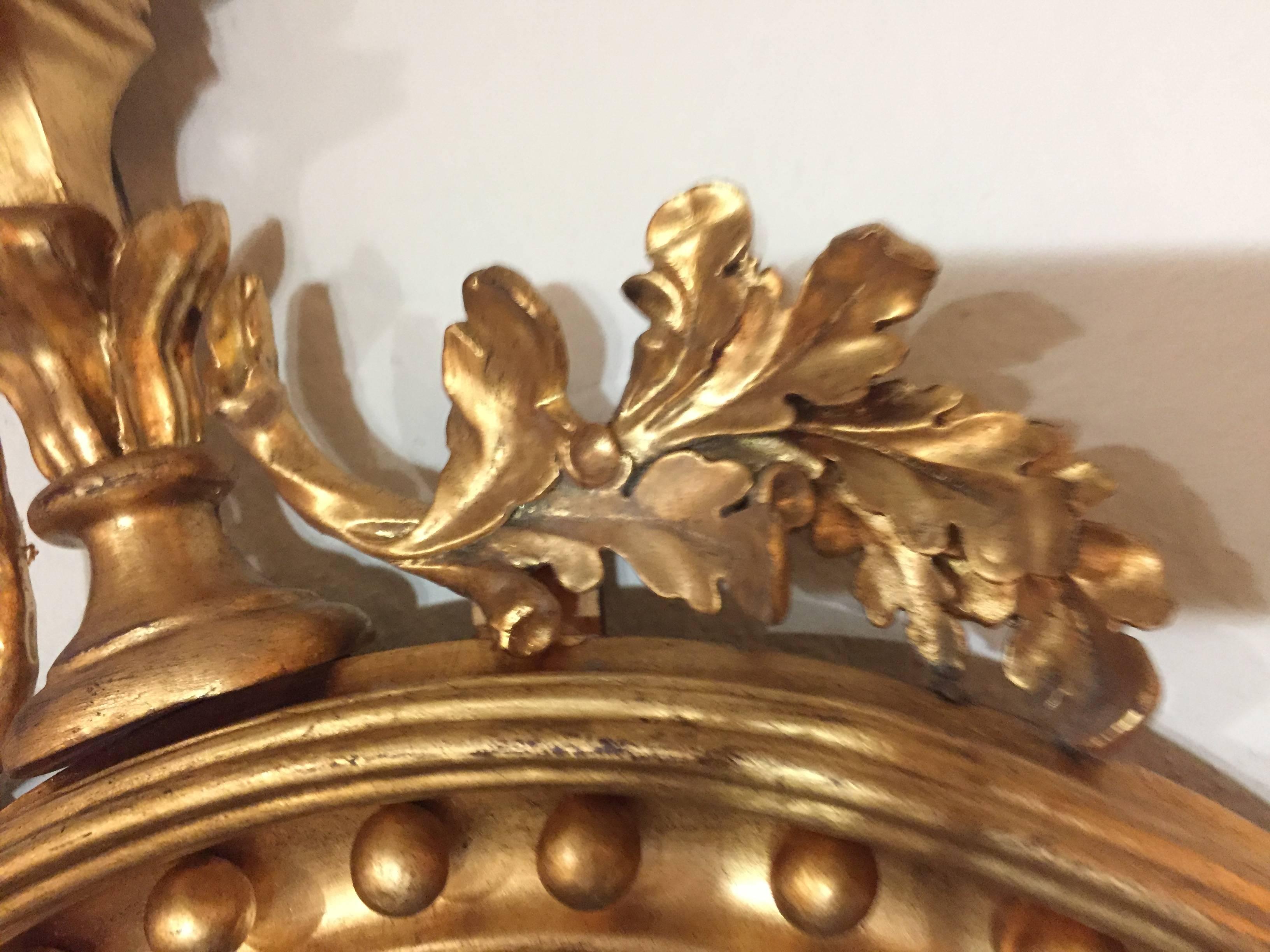 20th Century Federal Style Convex Mirror Ebony and Gilt Adorning an Eagle Winged Crest