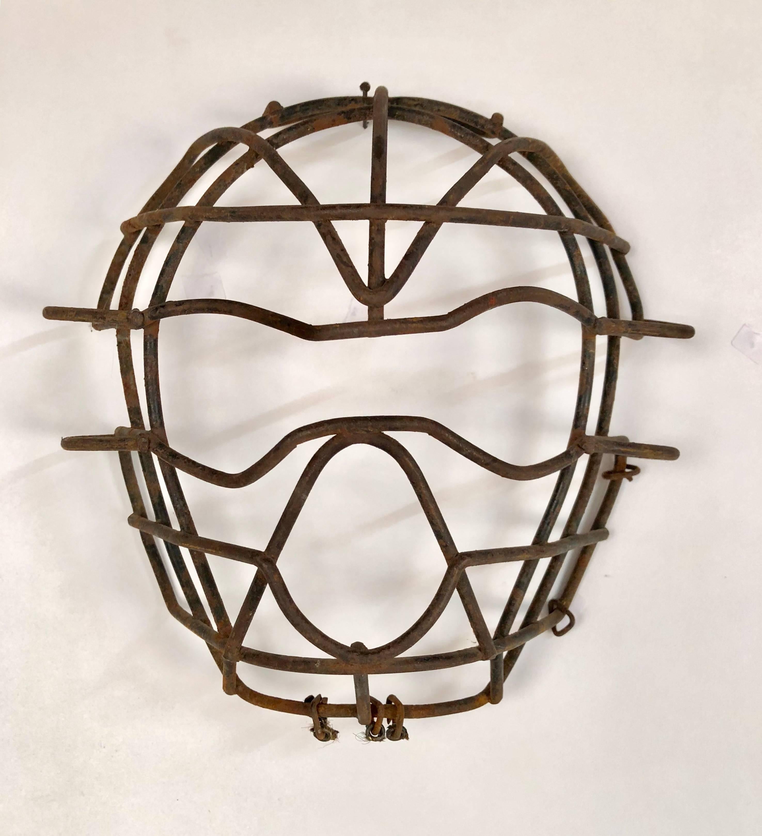 Antique collection of nine metal catchers masks 1920s-1950s. Each handmade and welded vintage catchers can be either hung as seen or in a horizontal or diagonal row. Custom quality frames by the designer himself can be purchased for a small