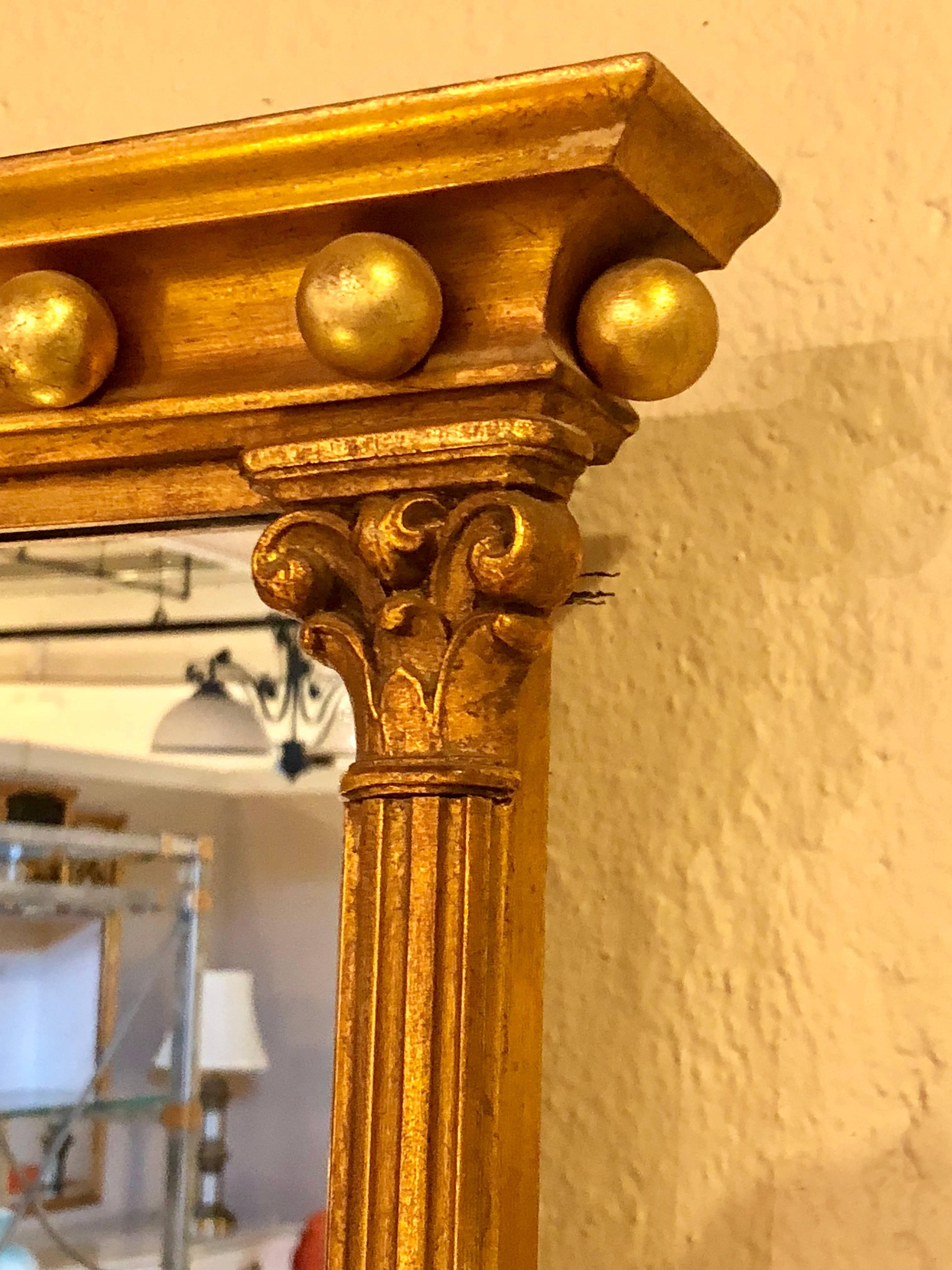 Pair of Gilt Gold Wall or Console Mirrors with Column Form Sides and Carved Tops In Good Condition In Stamford, CT