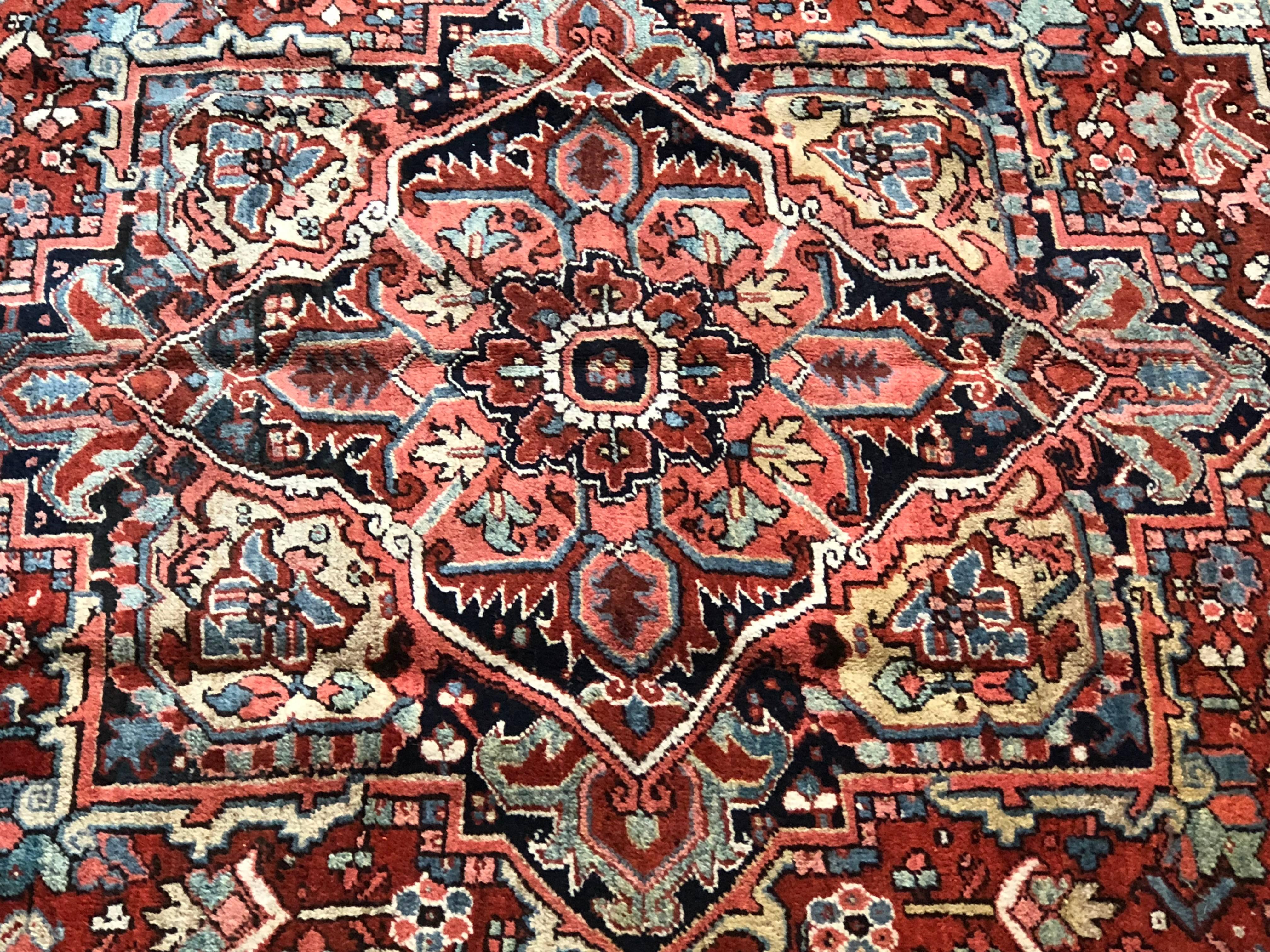 Heriz Oriental rug, circa 1920 fine geometric form on this Persian carpet. This carpet has just been professionally cleaned and hangs on the wall rather than sitting on the floor in our showroom.
