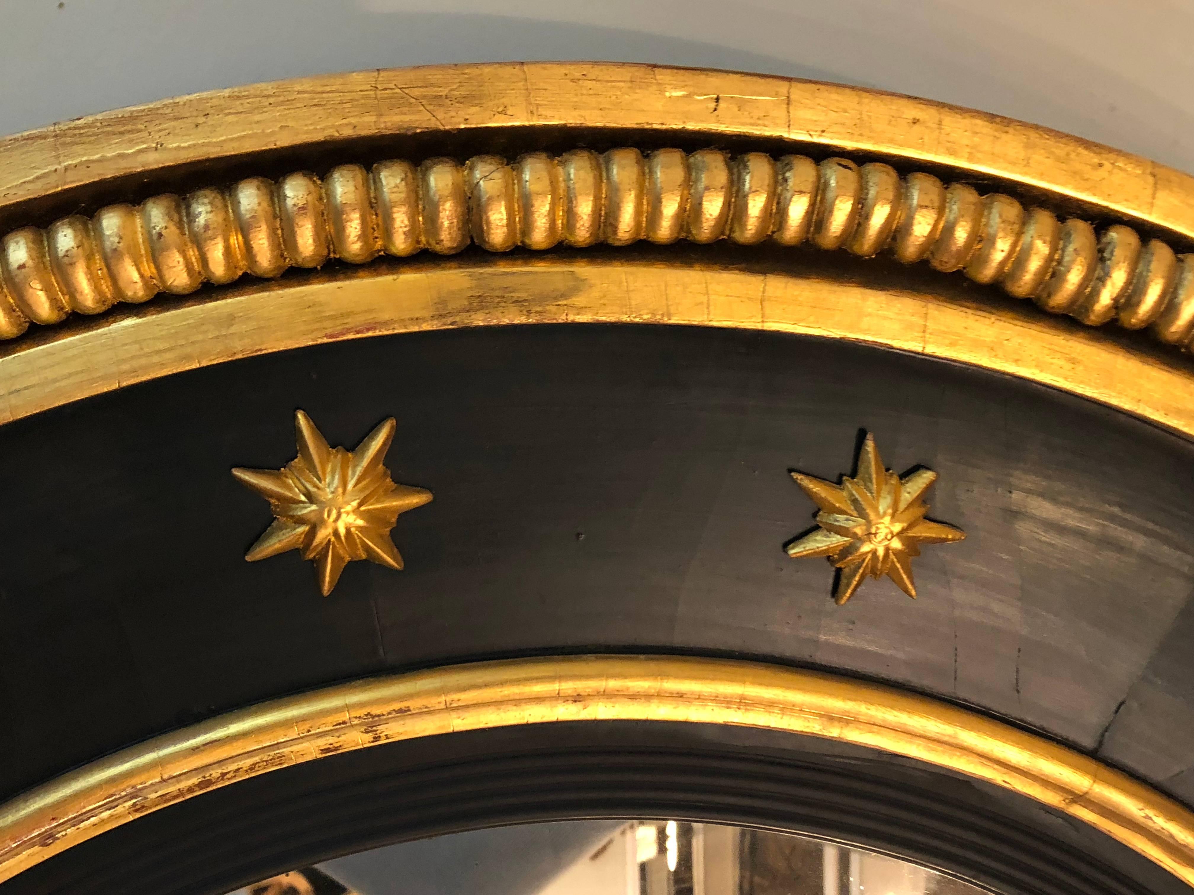 Konvexer geschnitzter und ebonisierter Bullseye-Spiegel aus vergoldetem Holz, Regency-Stil, spätes 19. Jahrhundert (Geschnitzt) im Angebot