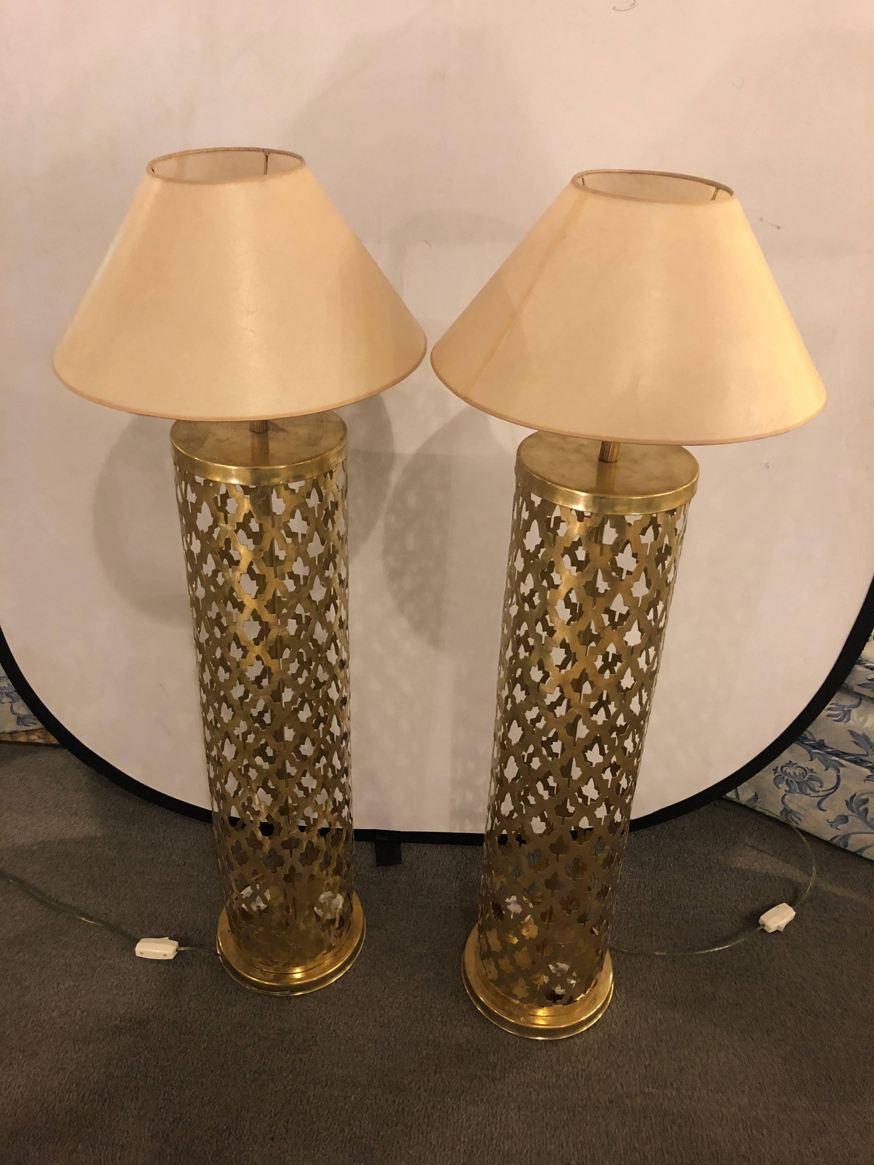 Tall handmade brass pair of lamps with two bottom lights and upper light. This handcrafted tall floor lamp is hand-tooled bronze in amoorish elegant and modern style. The lamps create a diffuse light. creating a soft and soothing effect.
   