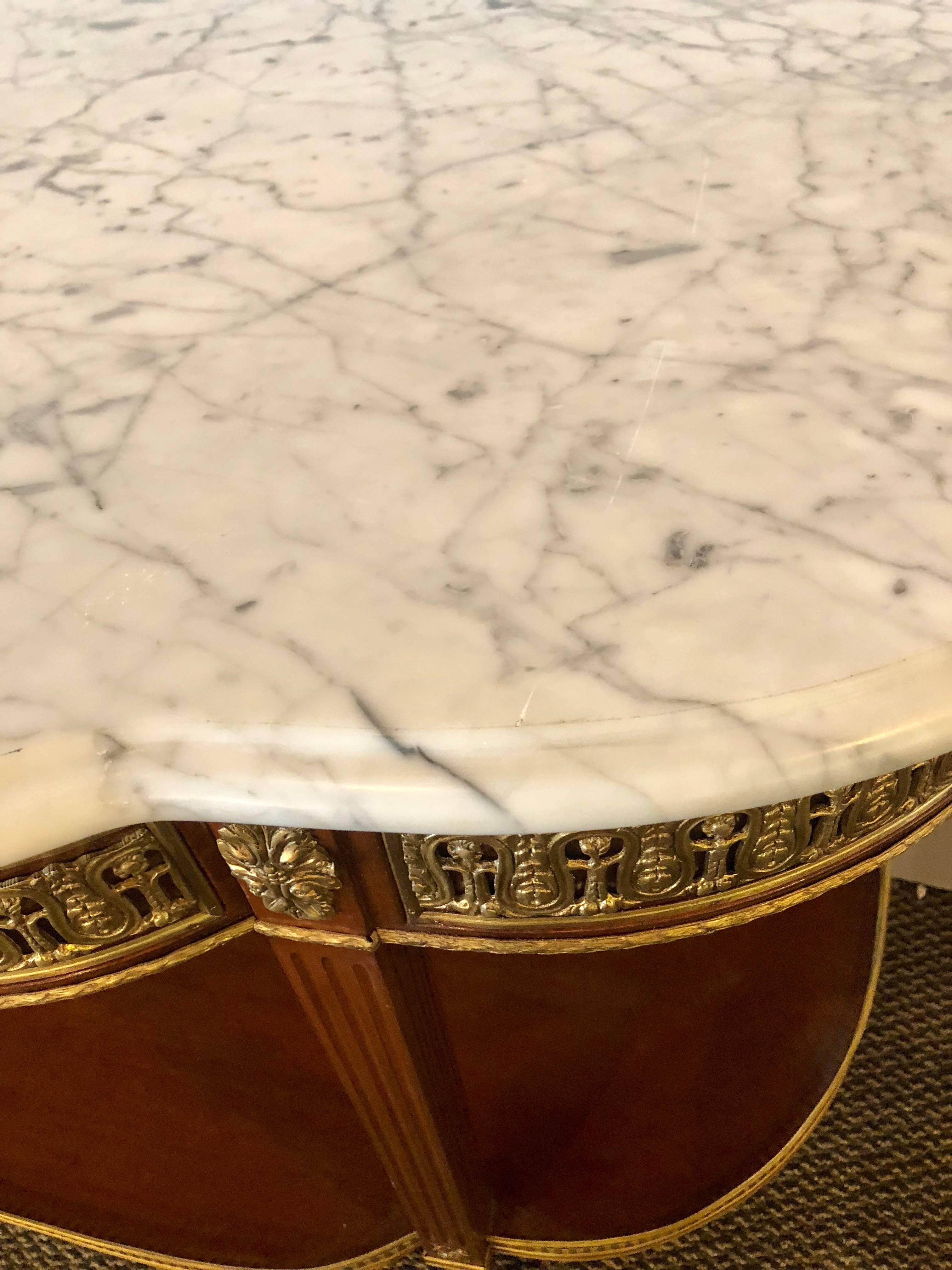 A fine pair of Palatial Louis XVI Jansen style marble-top console tables or sideboards with bevel mirror back panels. This pair of Maison Jansen style demilune form console tables are not only monumental in size but the custom quality is second to