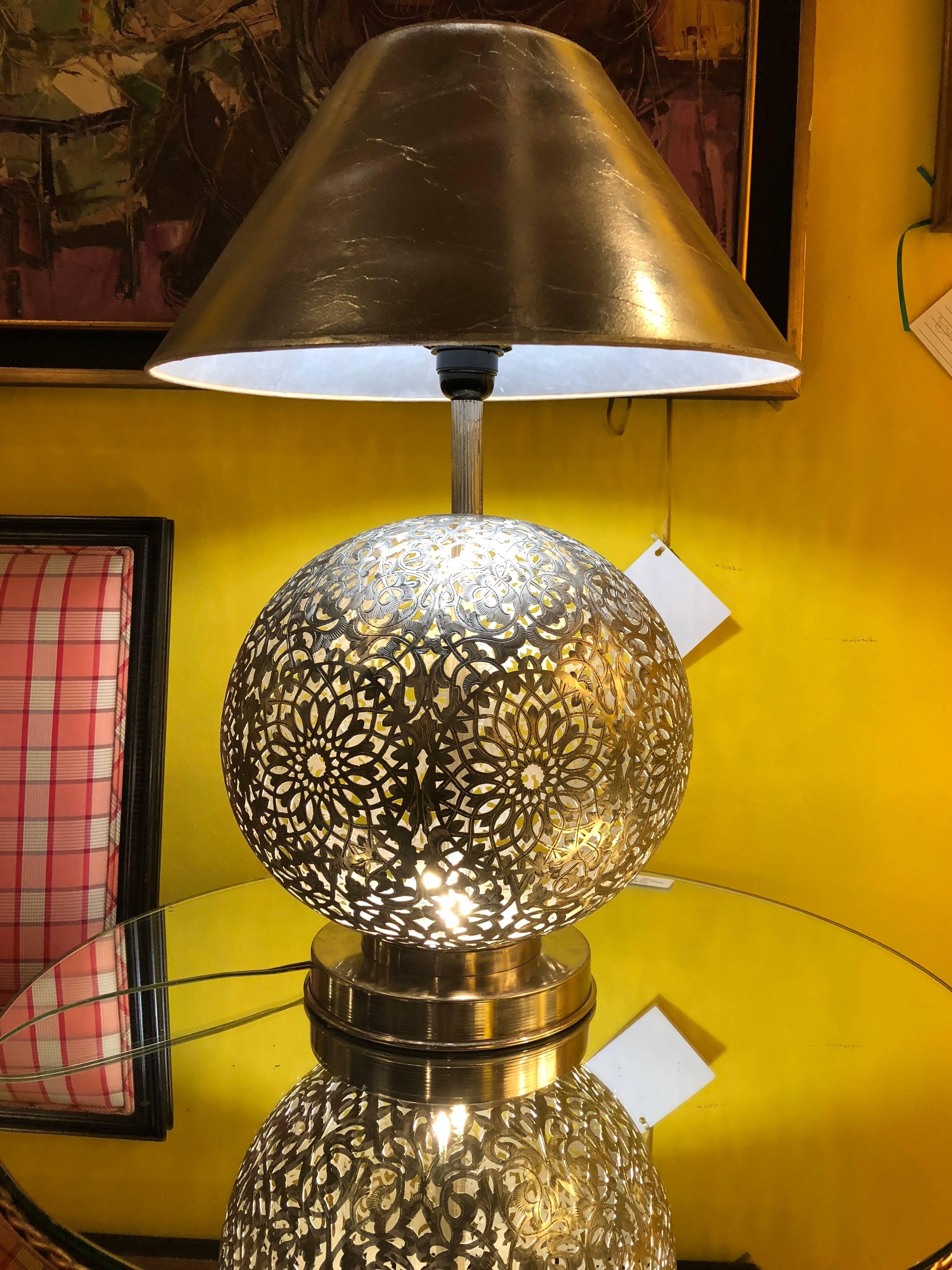 Our round shaped metallic lamps from Fez are beautifully created in the workshop of master artisans and feature silver metal and intricate hand-tooled filigree work. The lamp produces a diffuse, filtered light, creating a soft, soothing effect.