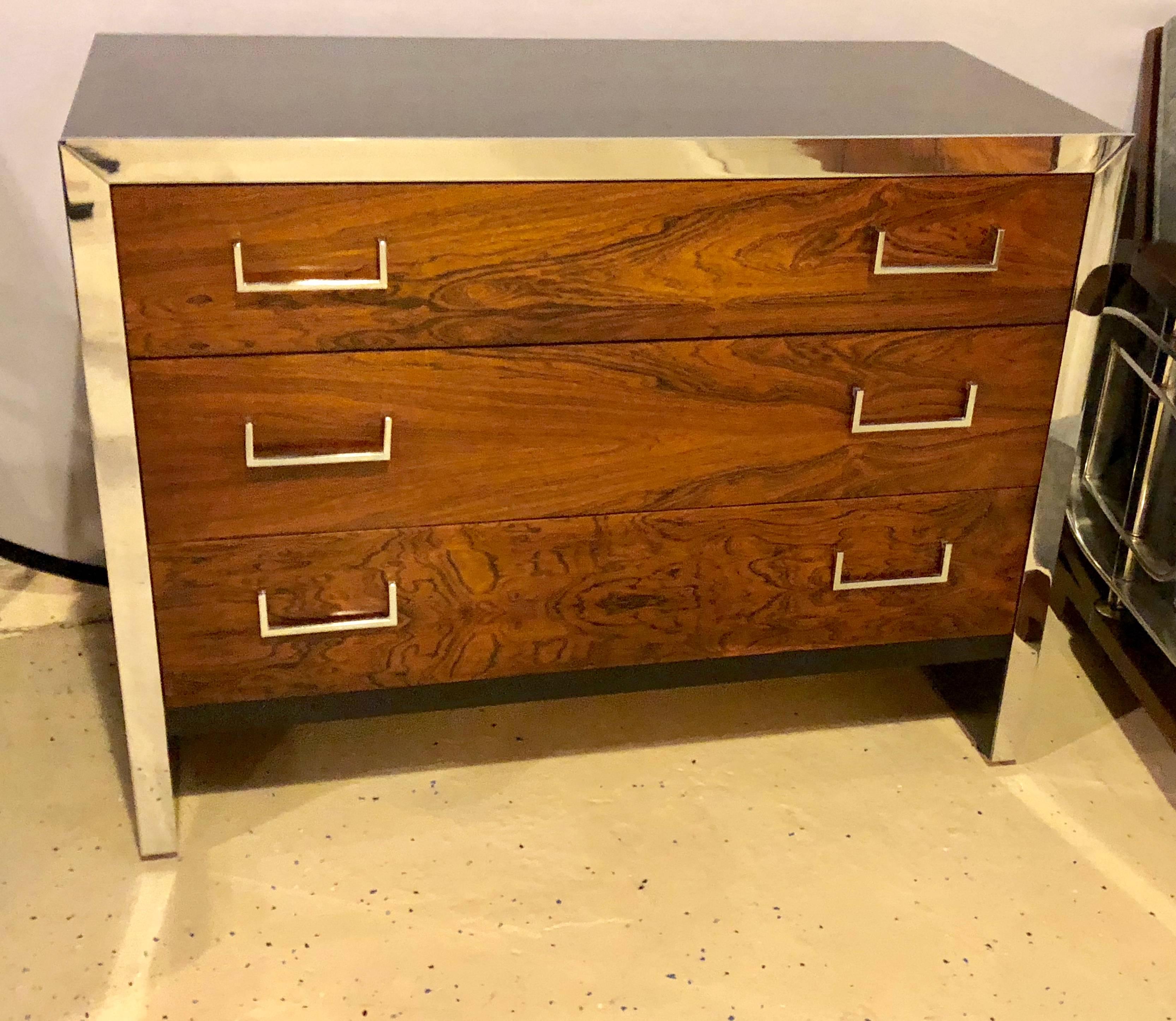 John Stuart chest ebonized and rosewood chrome-accented commode or chest. Fine simple lines showcase this wonderful commode with a rosewood front and ebony sides. The front with a chrome accented border. There is a matching mirror sold separately.
