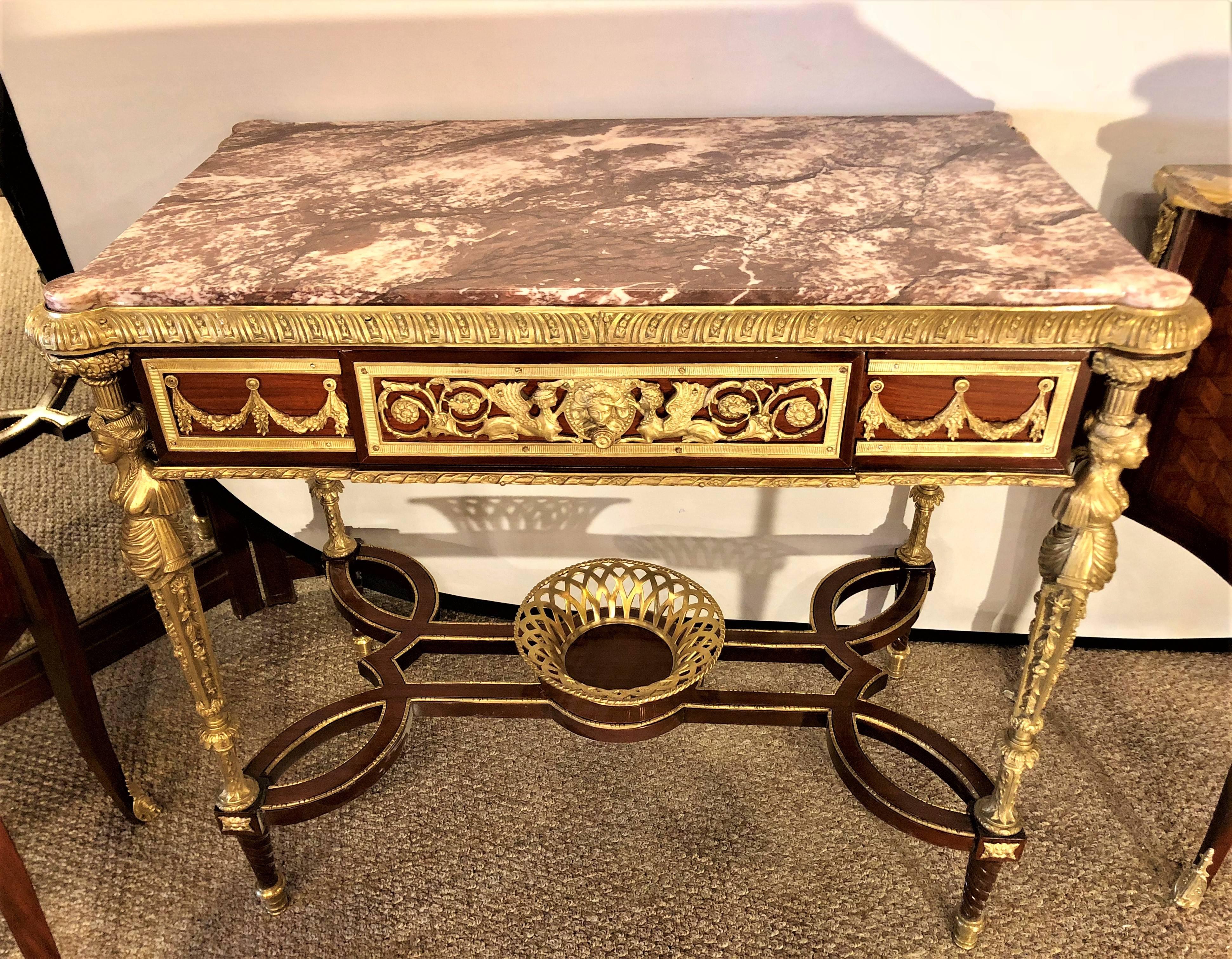 Fine Louis XVI Adam Weisweiler style center table or writing desk depicting four full bodied bronze woman. After a model by Adam Weisweiler.