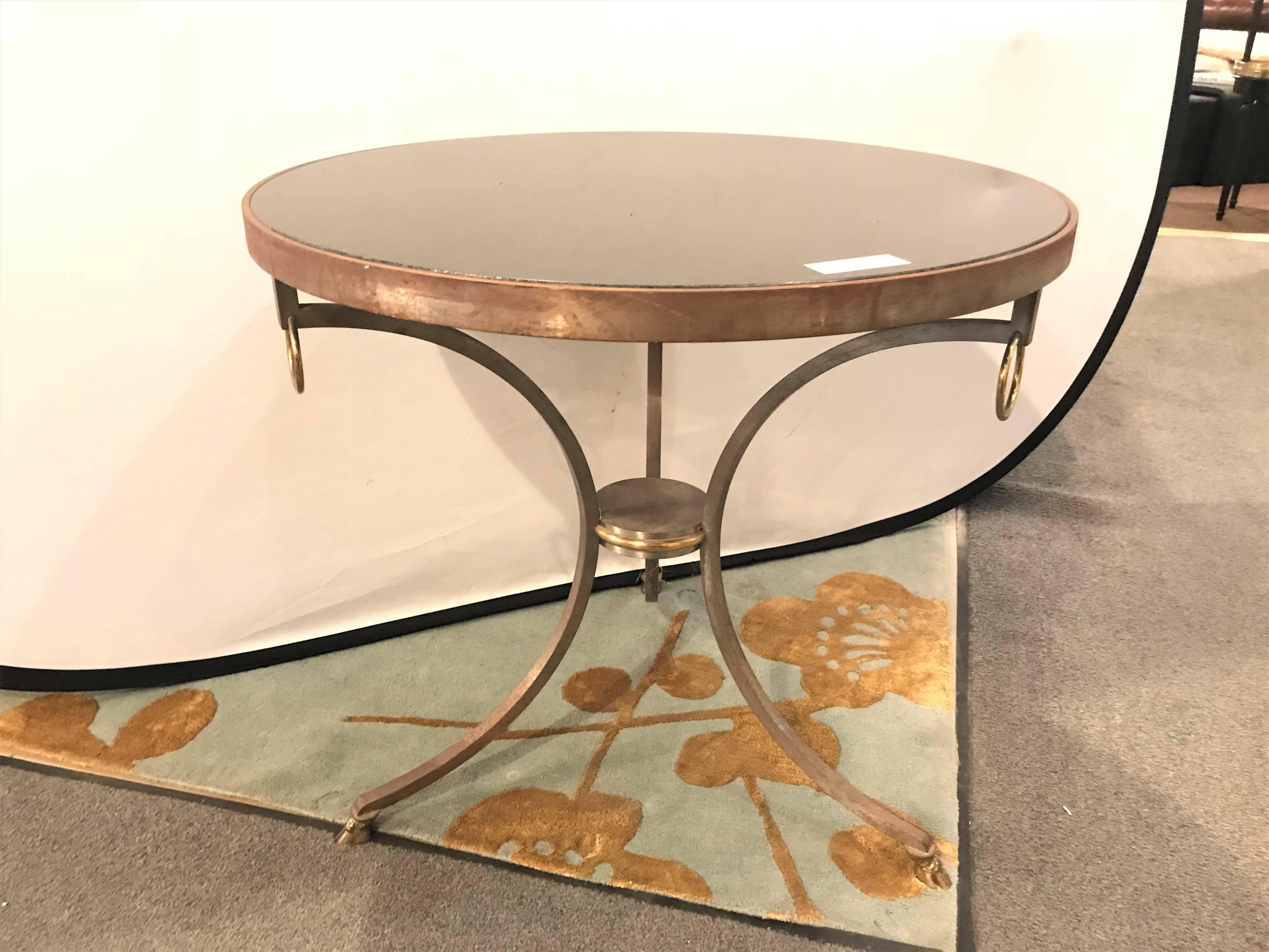 A French Directoire style iron and brass marble-top gueridon table in the fashion of Maison Jansen. Strong and sturdy.