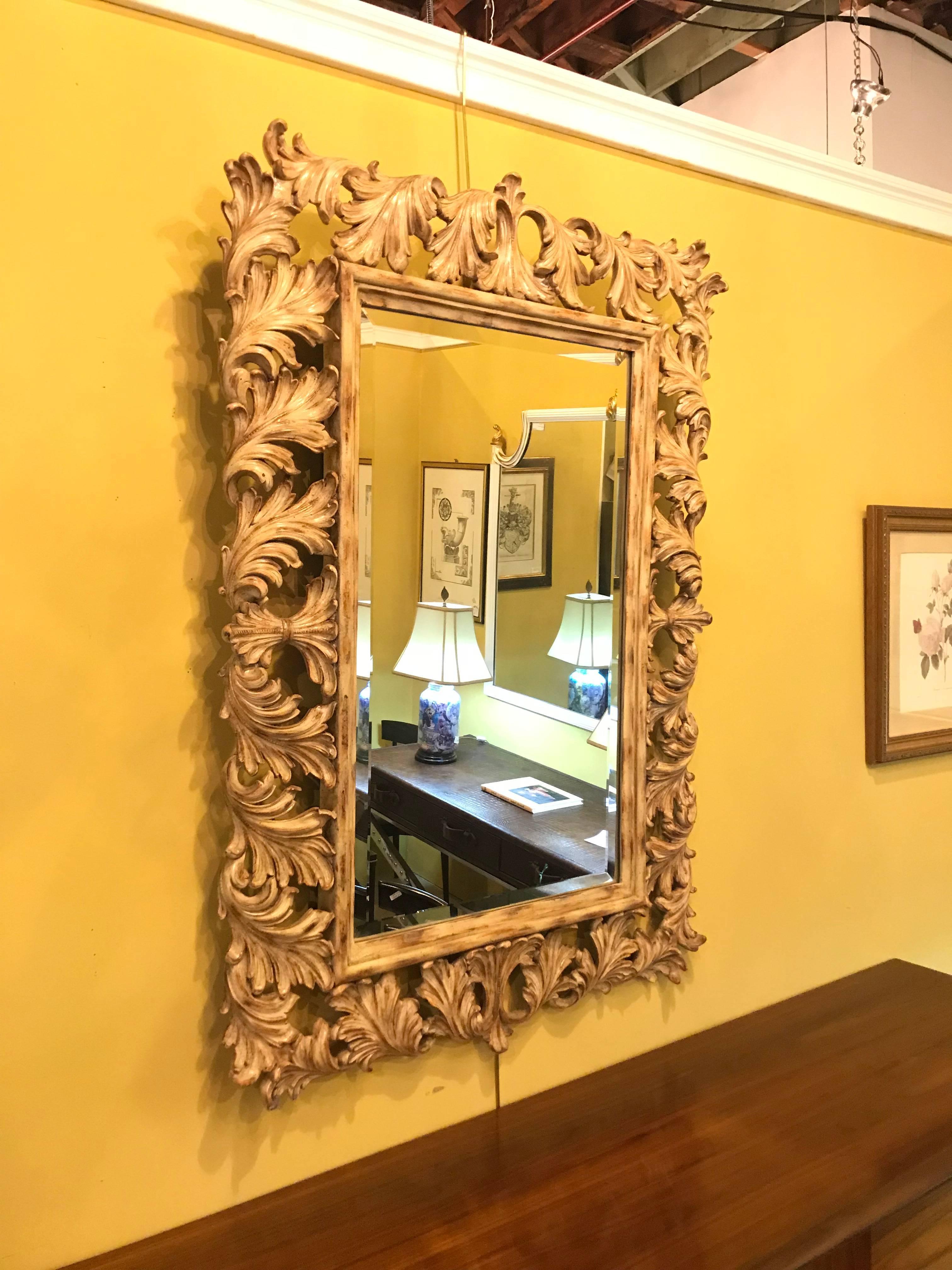 Mid-20th Century Heavily Carved French Frame Flanking a Bevelled Glass Wall or Console Mirror For Sale