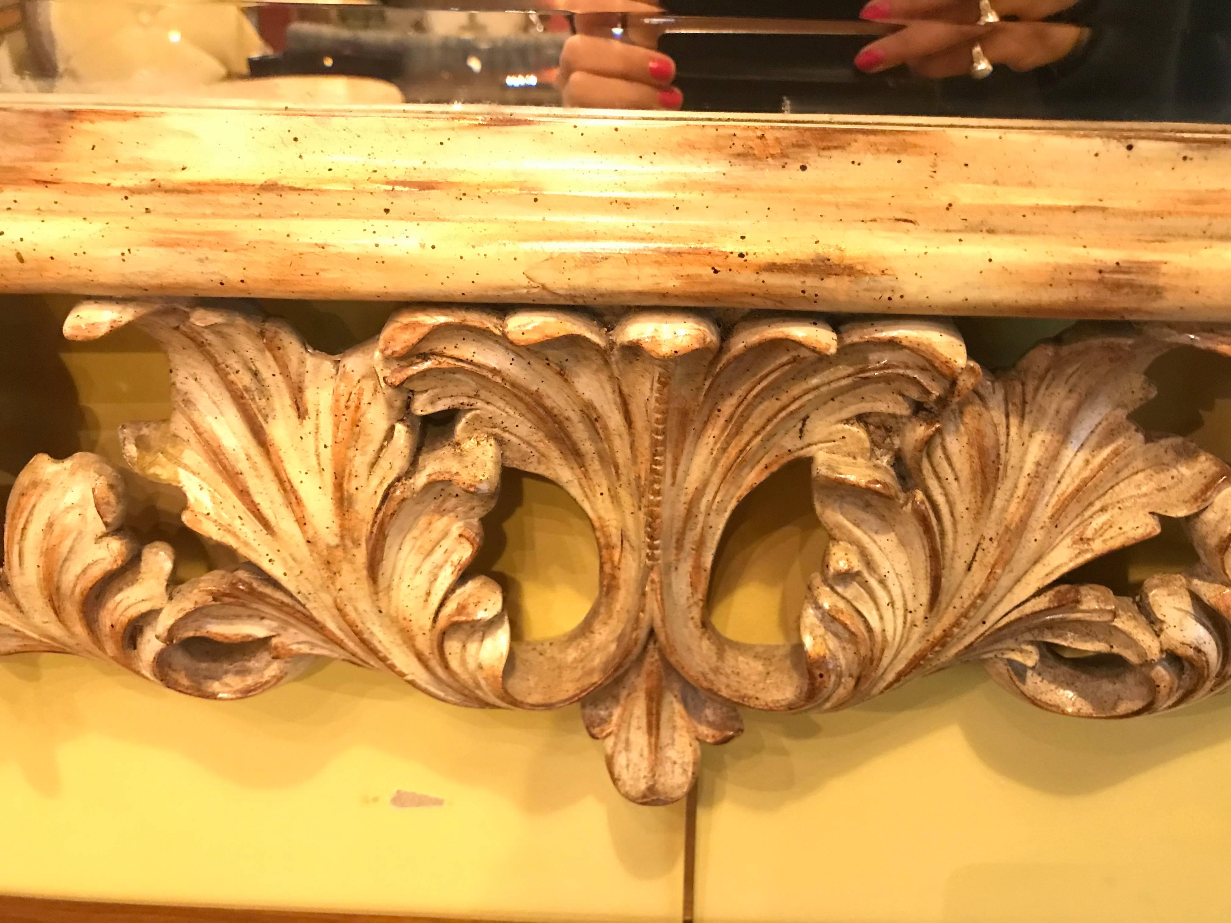 Hollywood Regency Heavily Carved French Frame Flanking a Bevelled Glass Wall or Console Mirror For Sale
