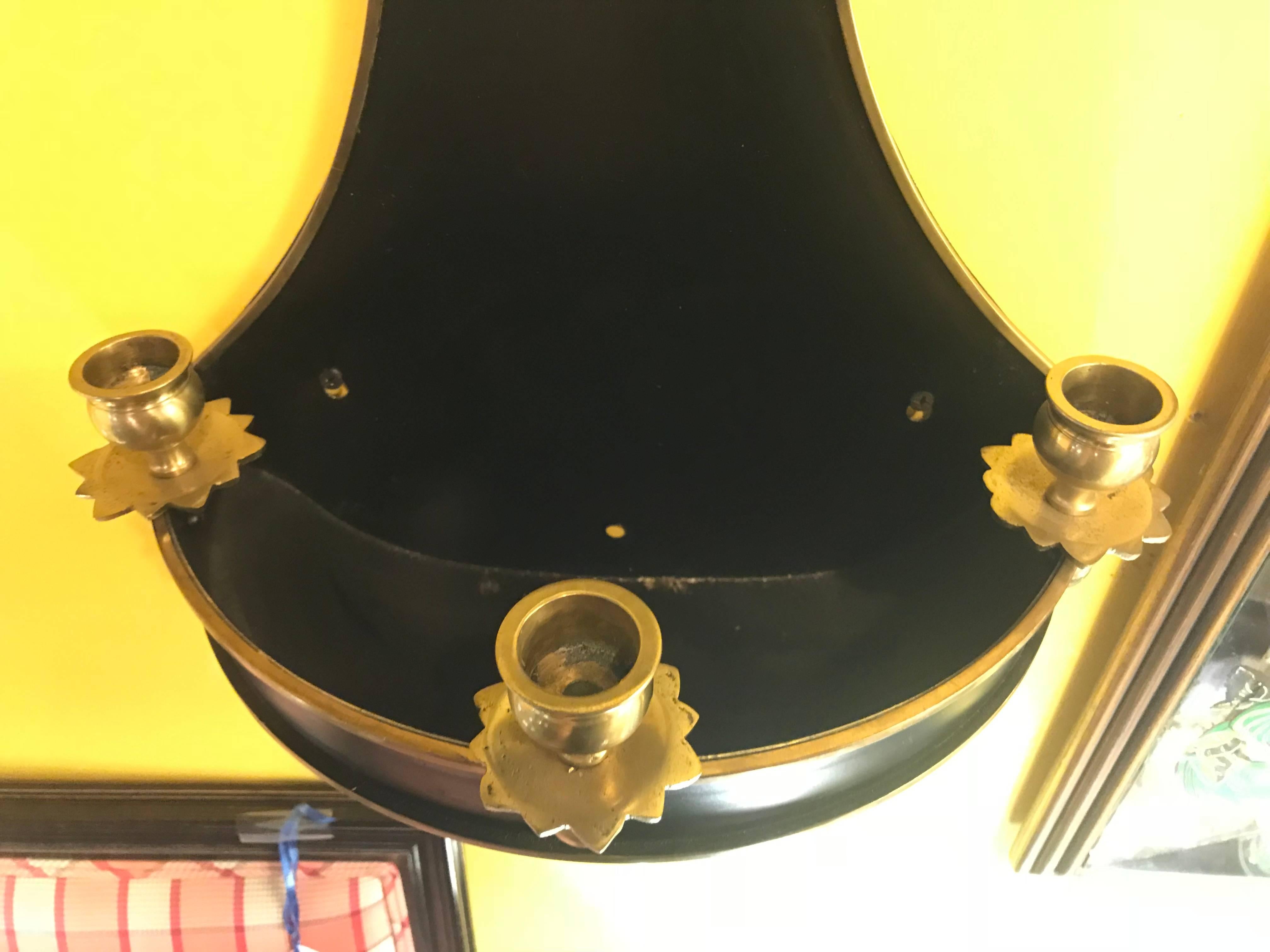 A pair of ebony and brass tear drop wall sconce planters.