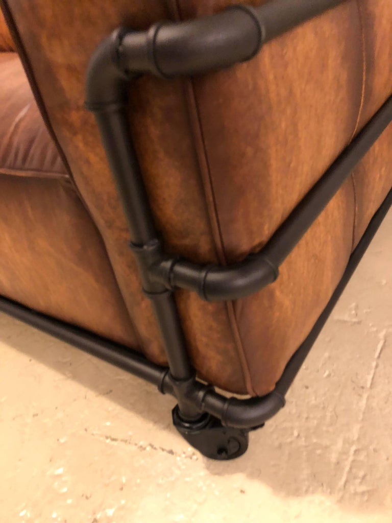 Pair of Industrial Style Sofas on Metal Frame Piping with Casters at