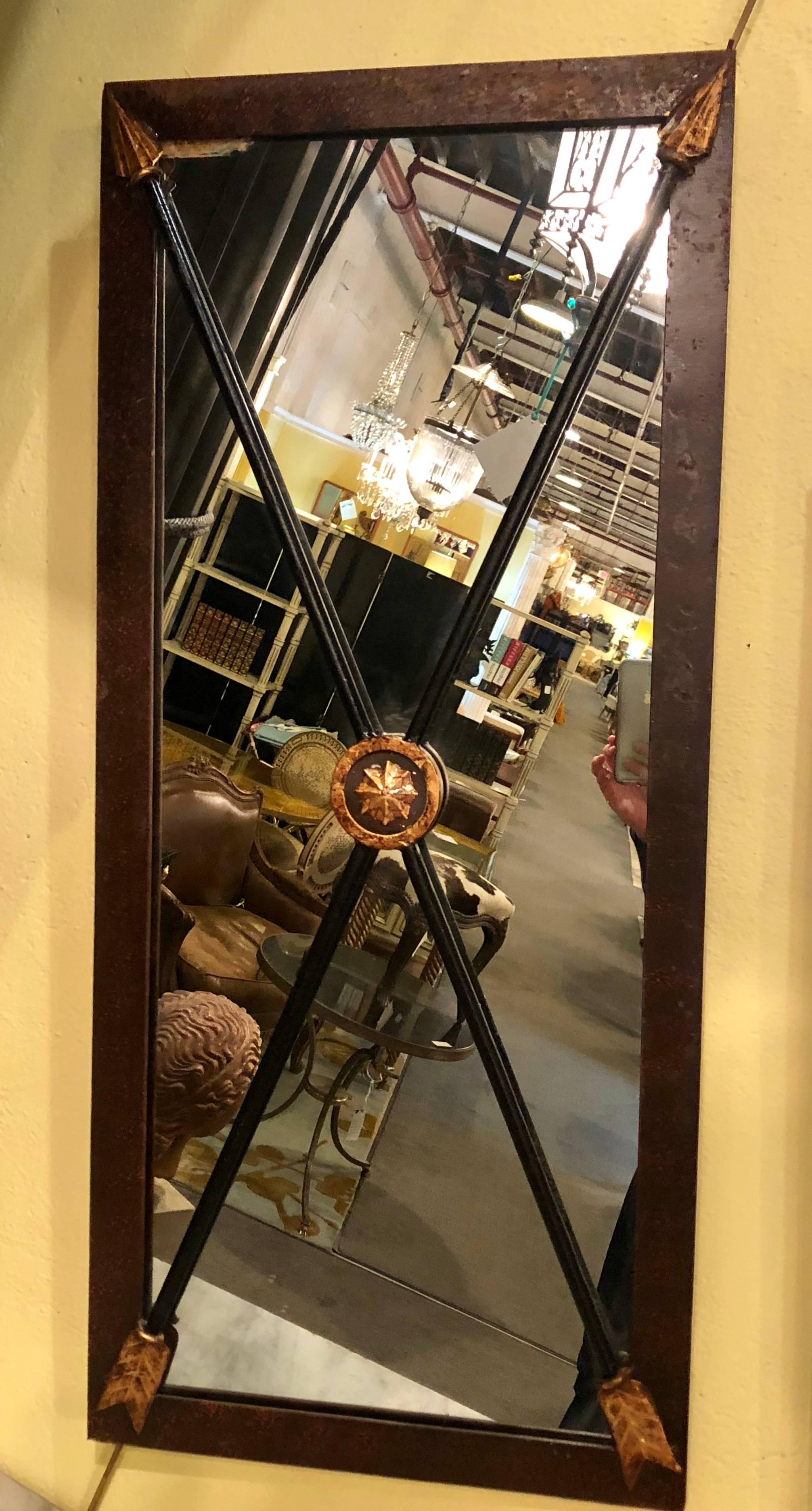 A pair of Industrial metal framed mirrors each with X-form ebony arrow decorated centers.