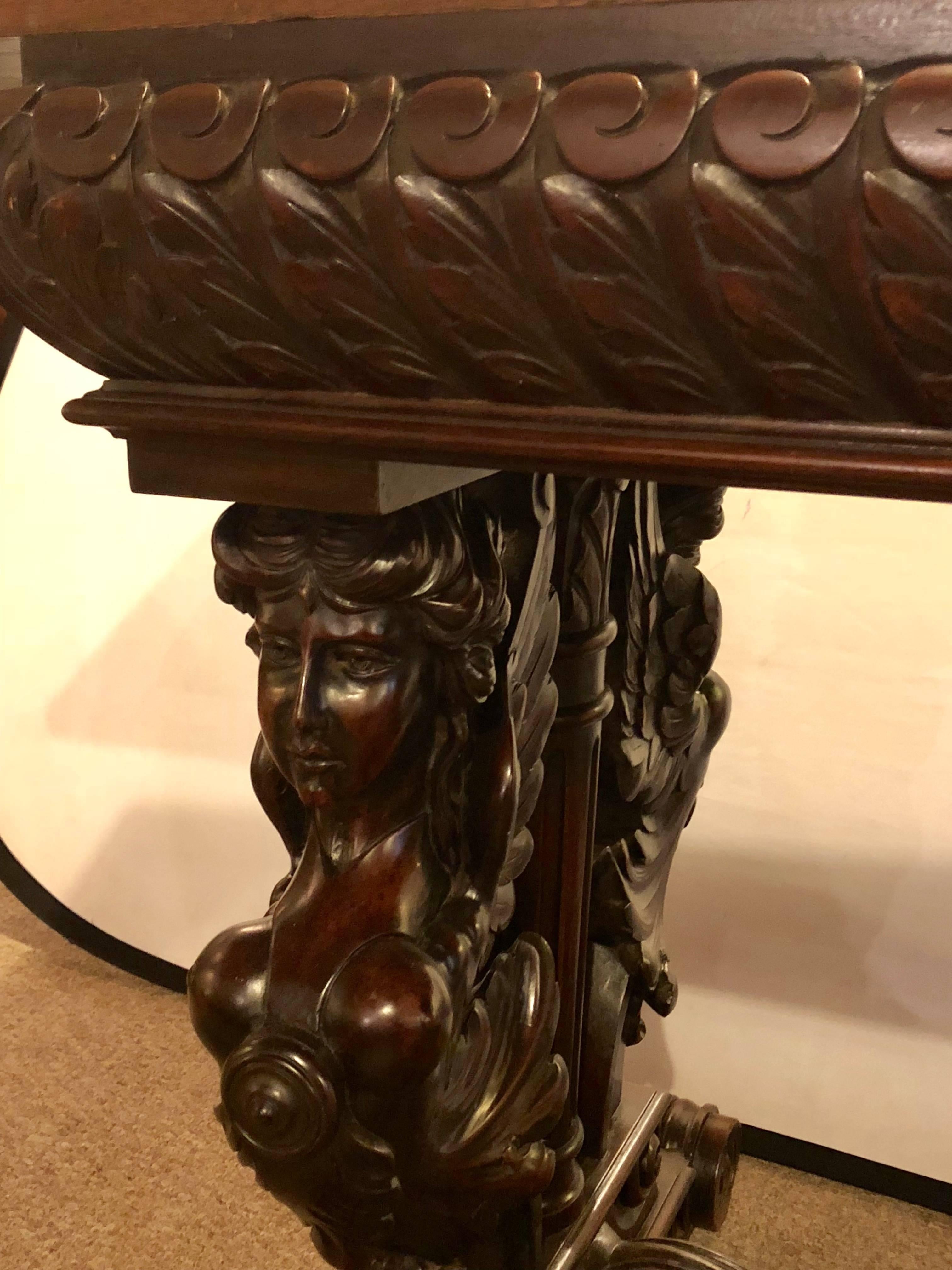 American Figural Carved Library / Dining Table or Desk with Carved Winged Maidens
