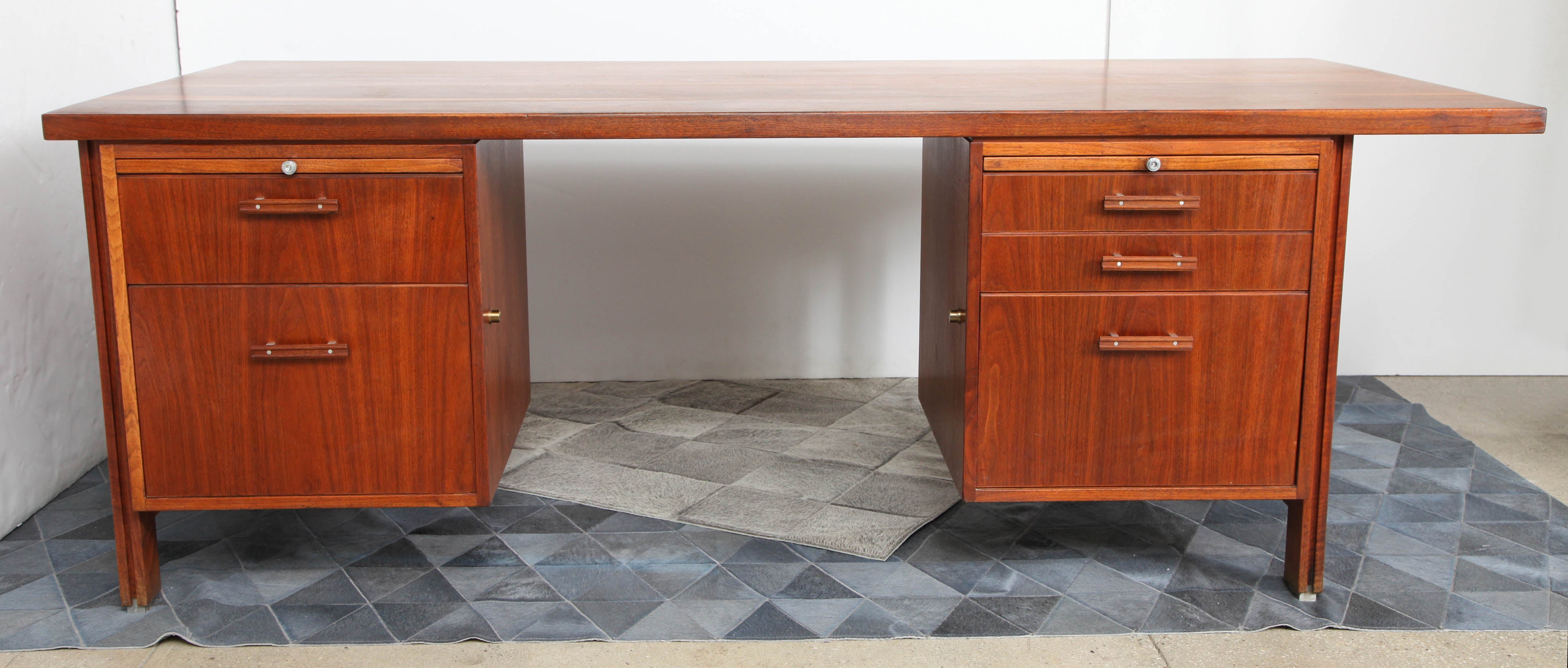 Robert Donovan walnut executive desk was commissioned by the wife of the president of Liberty Tool & Die Corporation of Rochester, NY and custom made for her husband. This was just one of the pieces that Tage Frid placed in the renovation of their
