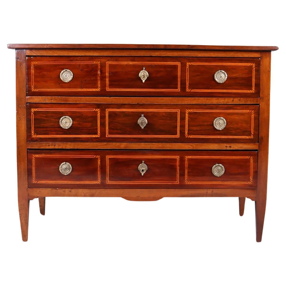Louis XVI Chest of drawers from early 19th century


Antique chest of drawers from early XIX century.
The body of the chest of drawers is made of solid walnut. Decorative inlays are made of light maple wood. The rectangular body rests on slanted