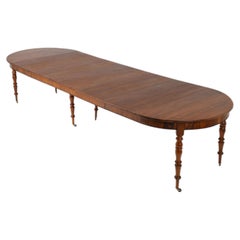 French Extendable Walnut Dining Table. France, circa 1850