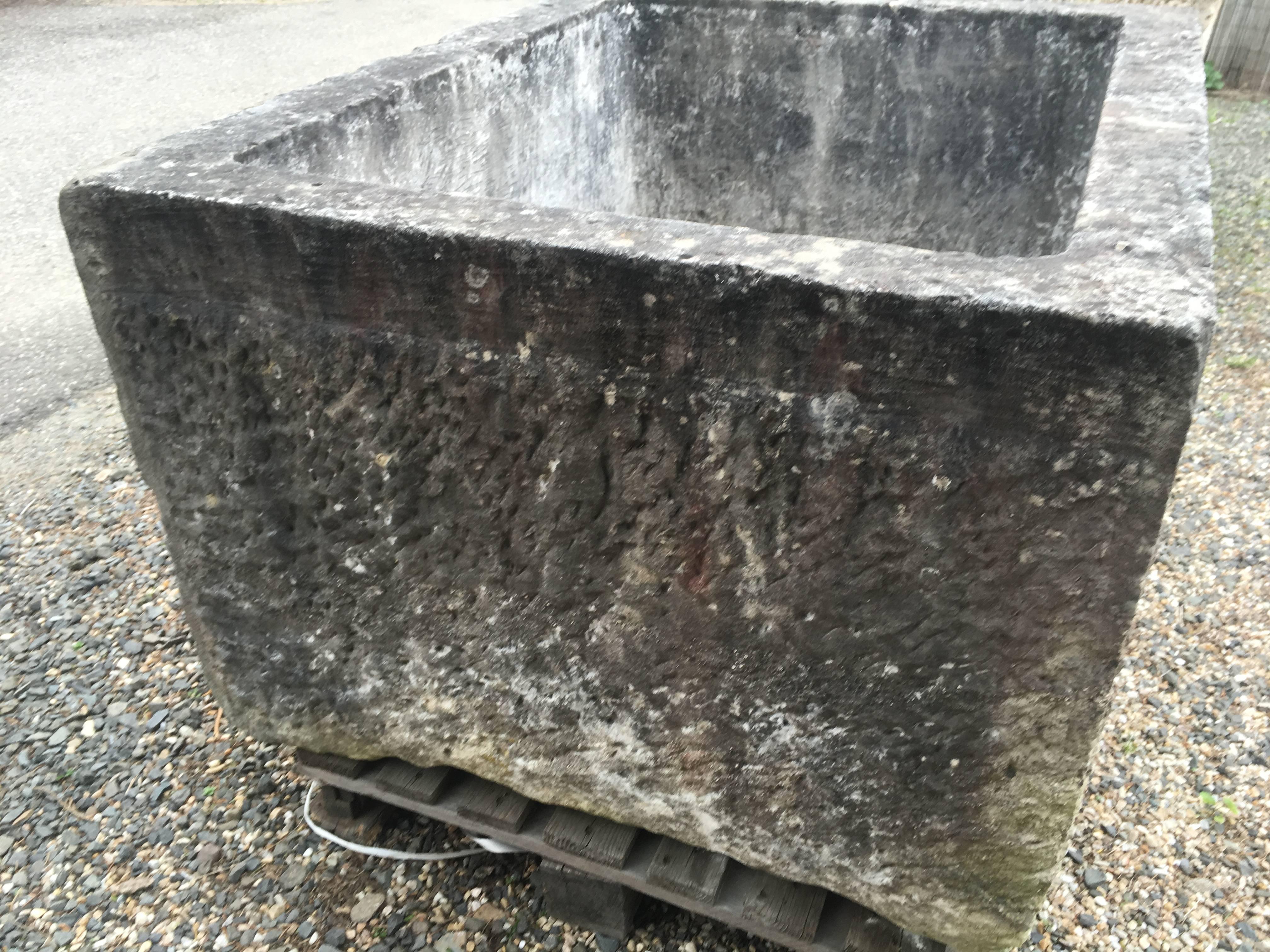 This rare carved limestone trough features a rare banded top edge that adds a whole different dimension to the piece. In wonderful condition, it would make a great stand-alone fountain in the center of a garden with a simple flume of water or plant