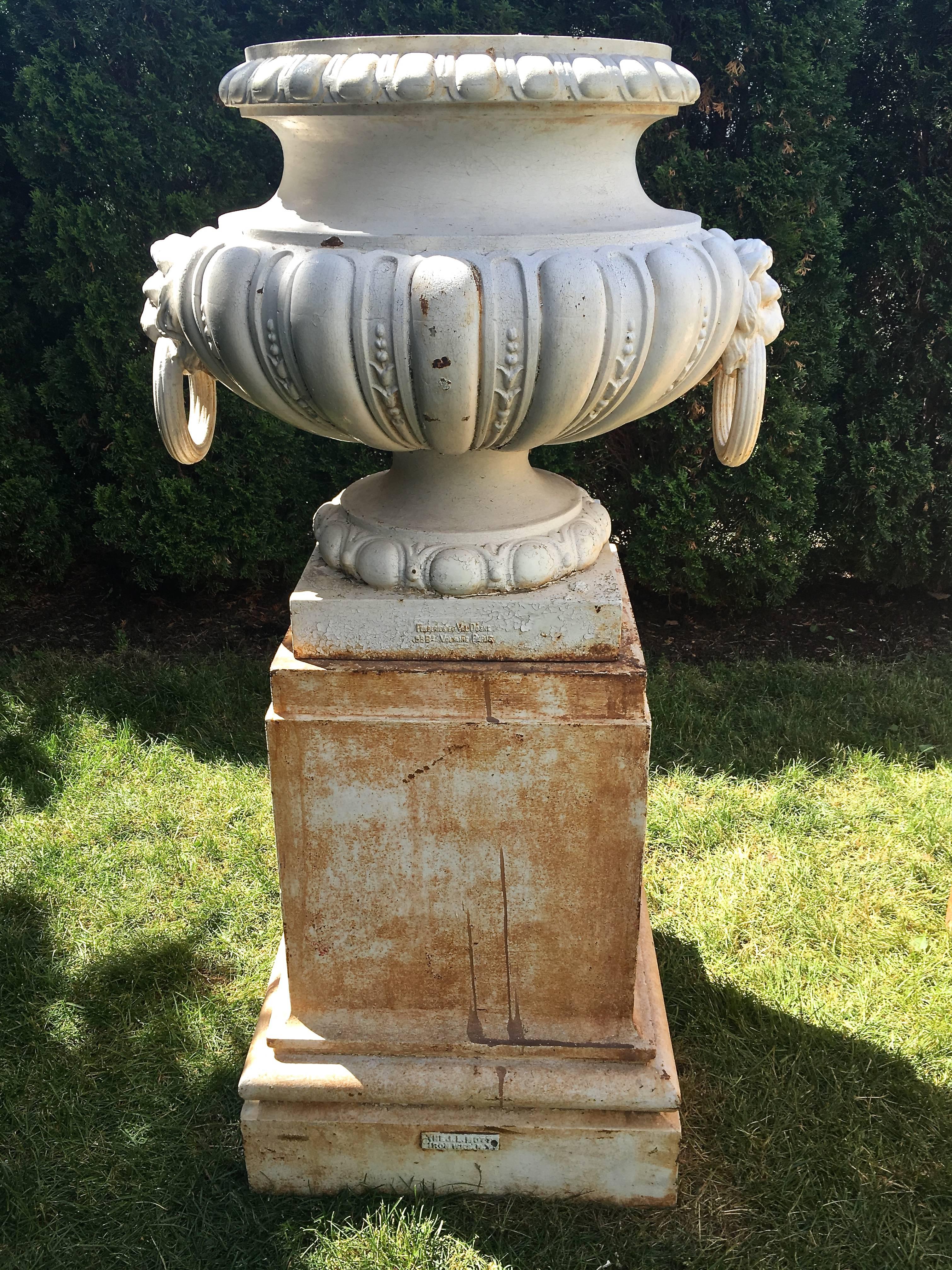 cast iron urns on plinths