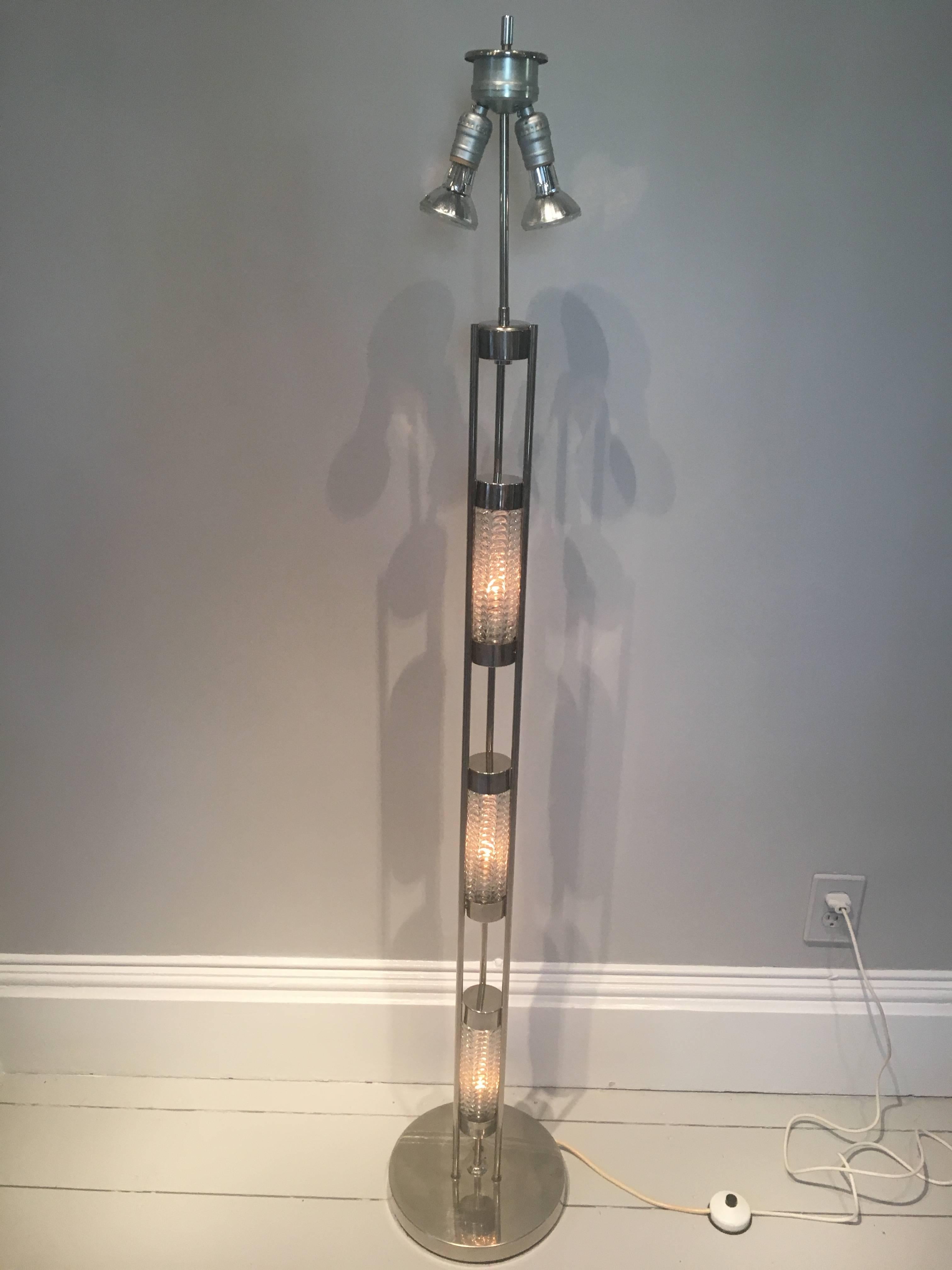 This floor lamp is a departure for us, but we just couldn't resist its exceptional design and presentation. The lamp has a chrome base and stem with three separately-lit vertical bubble glass sections that can be lit with or without the lights at