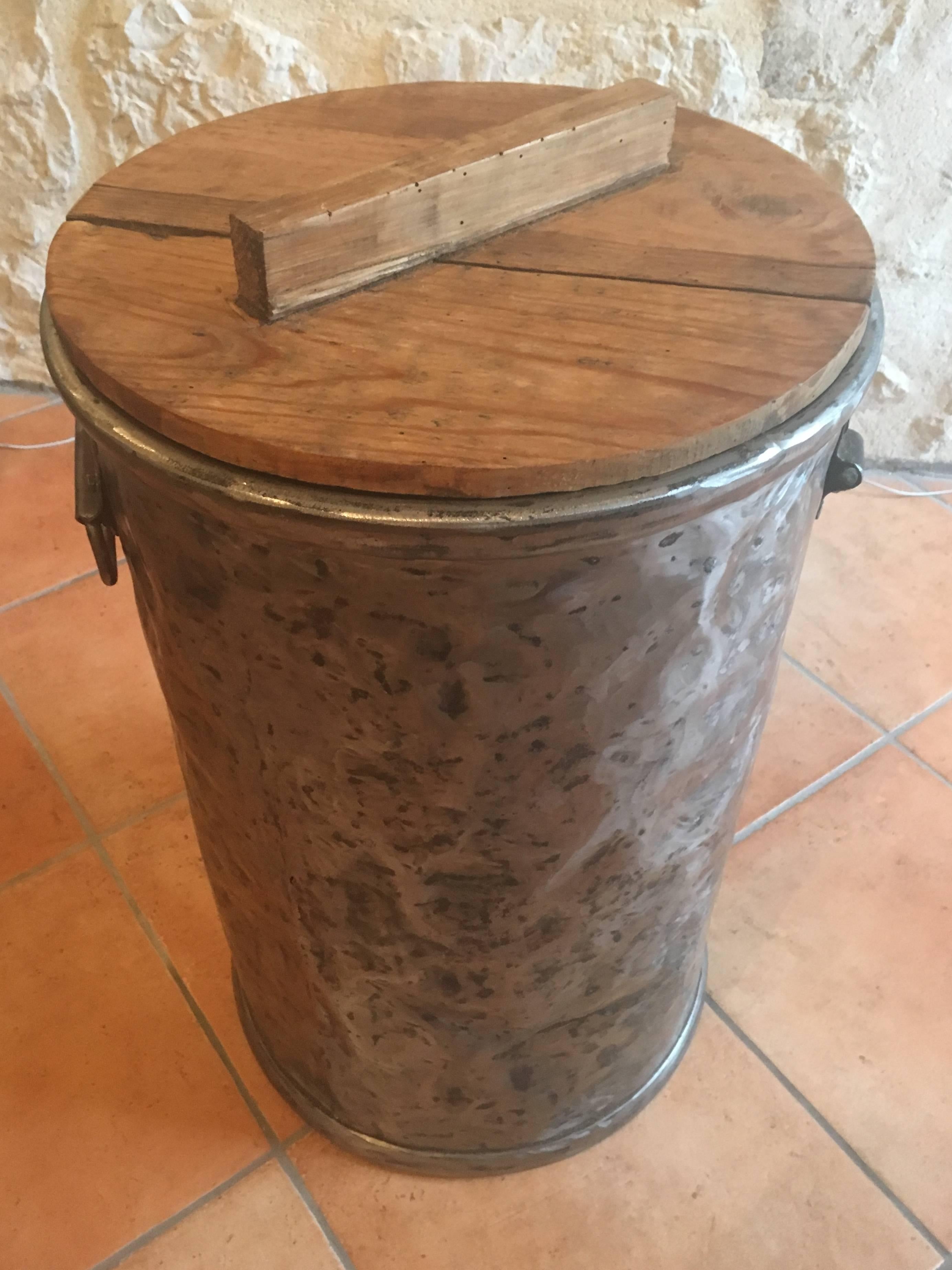 What a great storage bin! Beautifully made with original brass rivets and its original pine lid, this piece is perfect as a decorative trash can or storage bin for kindling. Please note that the top is not cracked... it is made from three pieces of