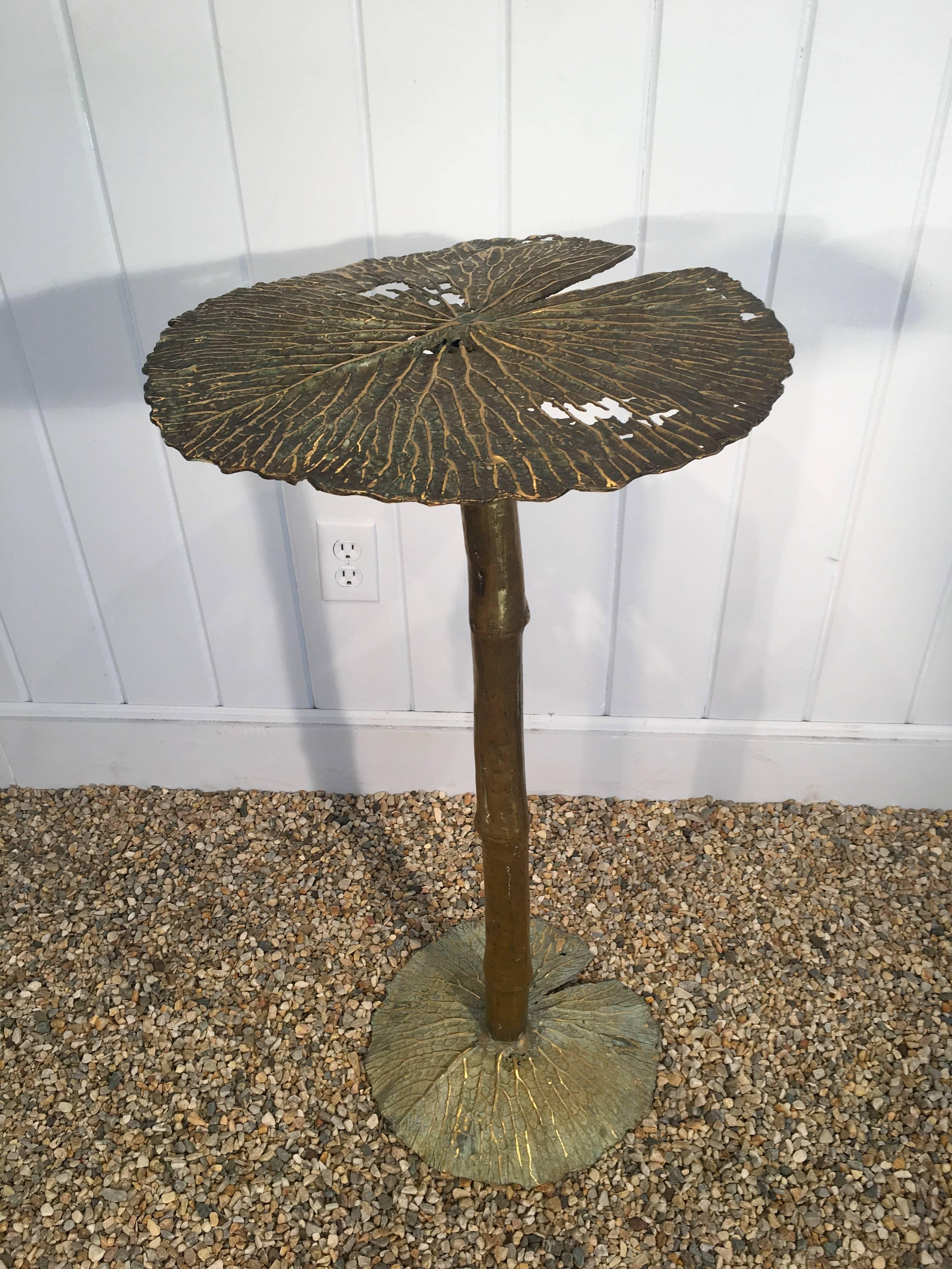 This amazing bronze lily pad leaf table is a one-of-a-kind and was handmade in France by a local artisan. Perfect as a side or drinks table inside or out, it is more sculpture than furniture. The patina is just marvelous. The top measures 16.5