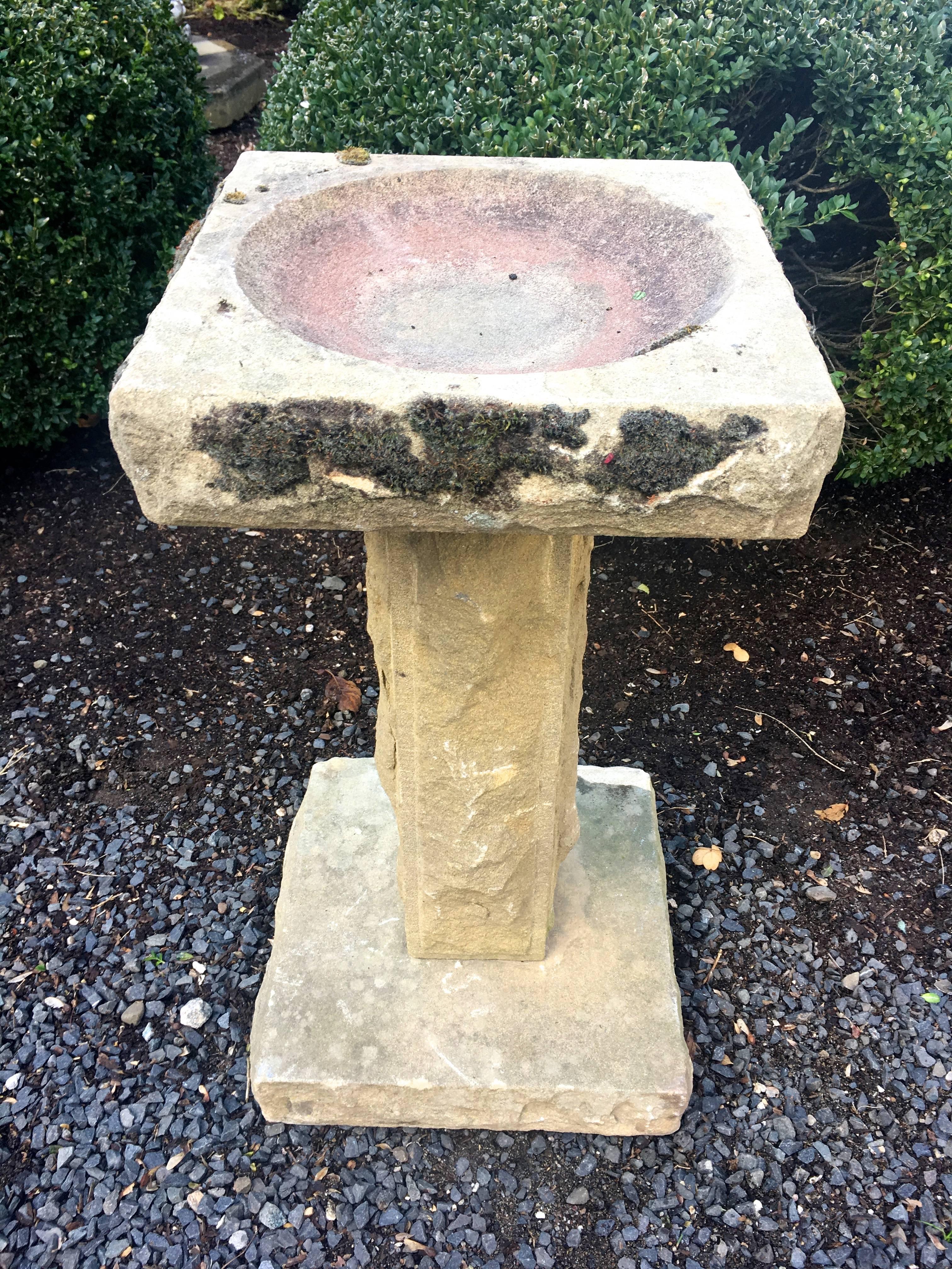 This elegant Edwardian birdbath in three parts is hand-carved and beautifully weathered with some mossing. In excellent antique condition, except for one area on the base that has some flaking (see last photo), it would be the ideal accent piece in