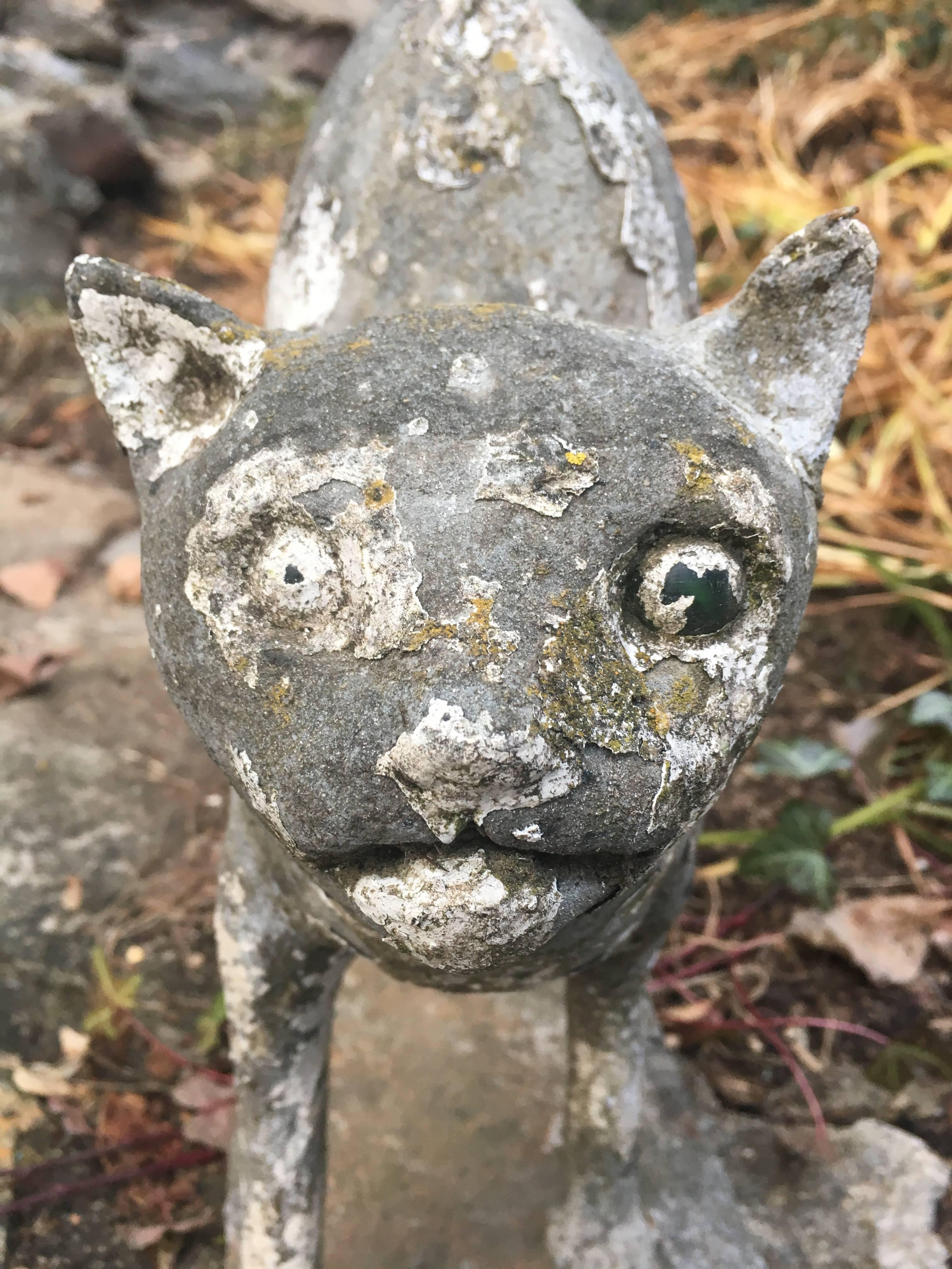 This wonderful Folk Art cat is exceptional. With remnants of old white paint and lots of lovely weathering, this arched-back Halloween cat will be the talked- about piece of holiday sculpture. Definitely handmade from cast stone, he has an old crack