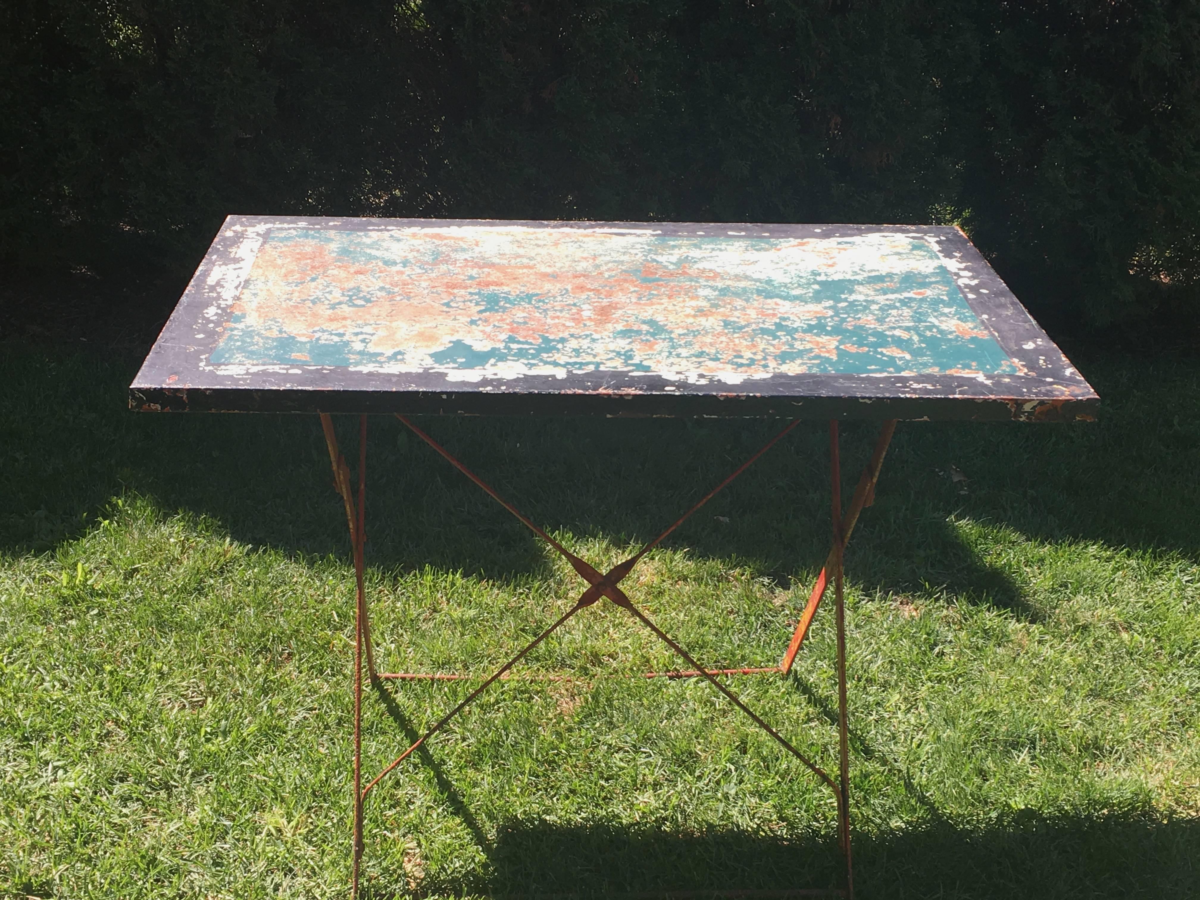 We love this versatile folding garden table for its crazy and brightly-painted original surface and easy folding mechanism. It would make a great side or serving table in your sunroom, on a porch, or in the garden for a lunch table for four. France,