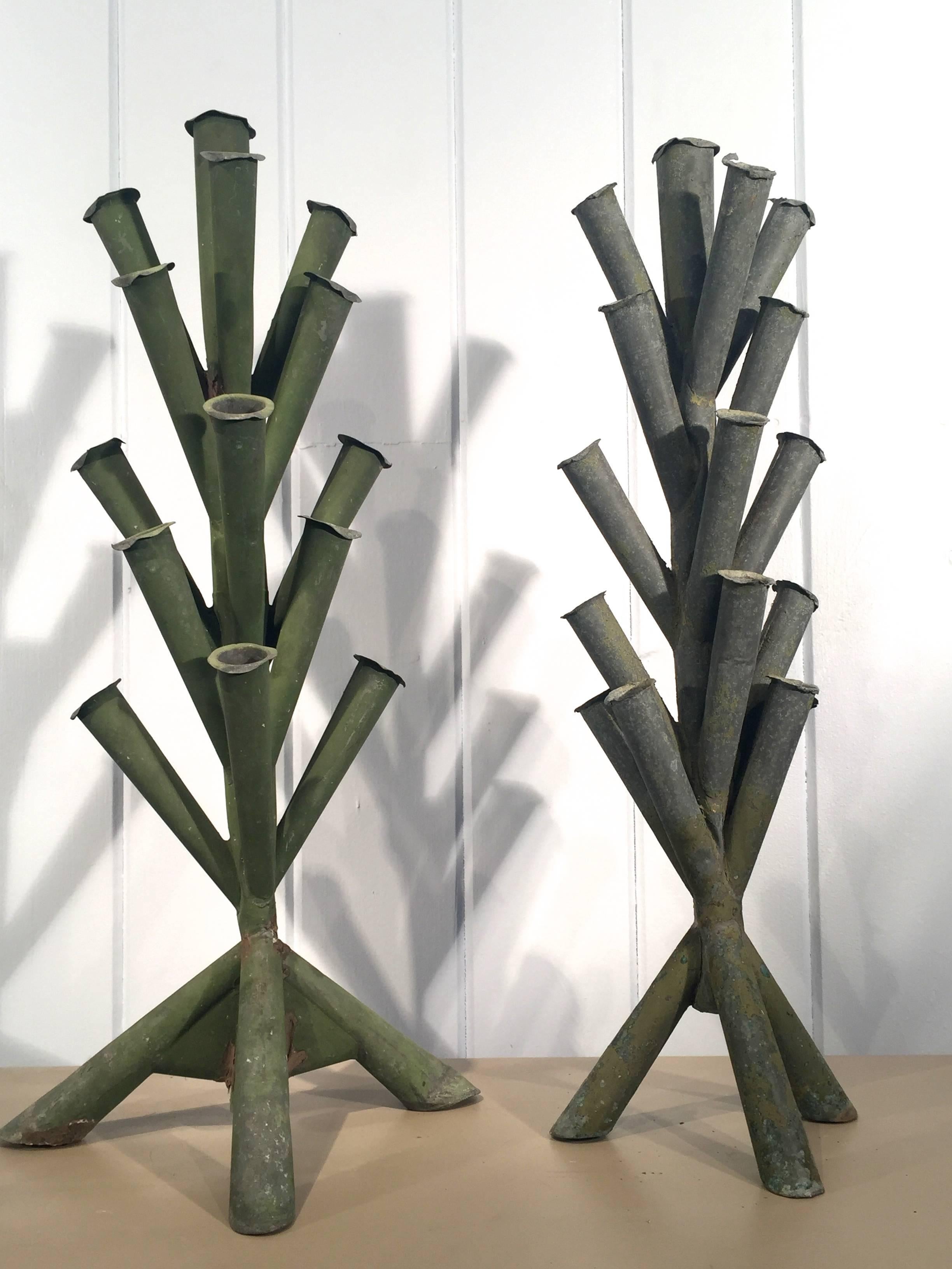 These lovely and unusual handmade zinc tulipieres were originally designed to hold tulip blooms. One sports a medium-green painted finish and the other is natural unpainted zinc. Their unusual form and contemporary feel makes them prime candidates