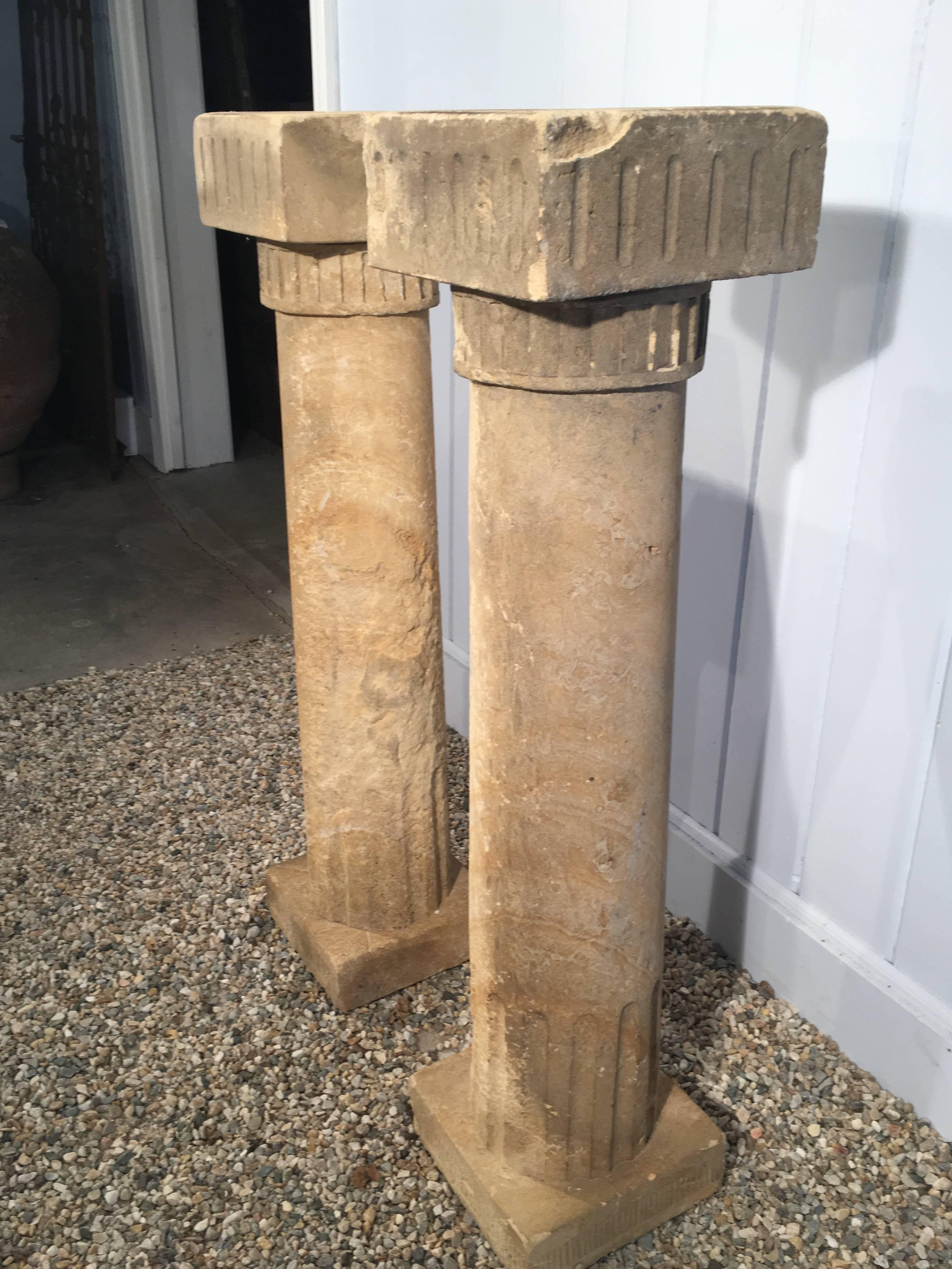 This stunning pair of 18th century hand-carved sandstone columns comes from the area around Marseilles and features classical Moorish-influenced carving on the tops and bottoms. In excellent condition for their age, they work beautifully flanking an
