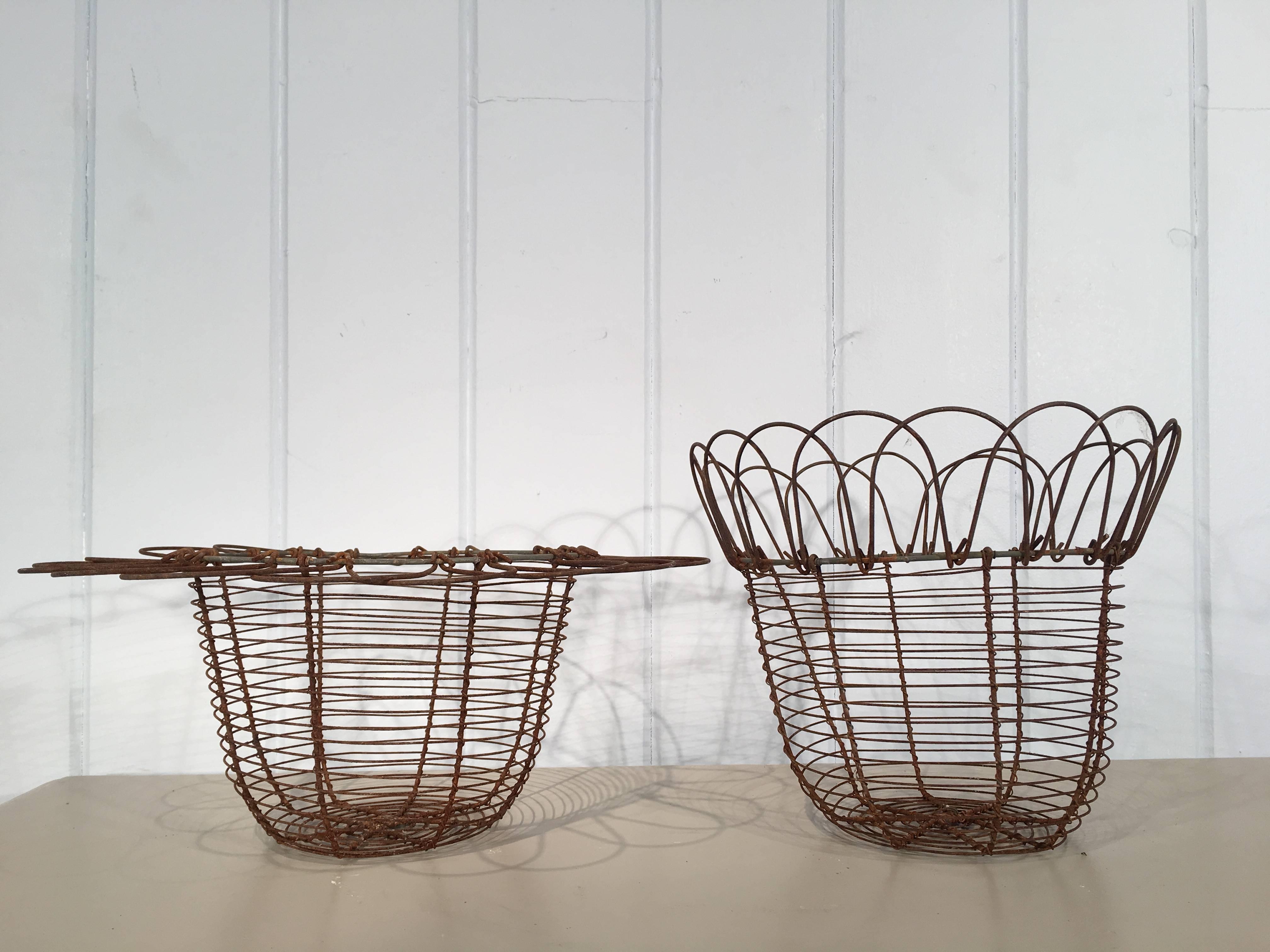 This lovely pair of wire egg baskets has adjustable rims that easily move up or down according to your mood. They are very hard to find these days and are in excellent condition. Use them in your kitchen to hold eggs or as tabletop decorations