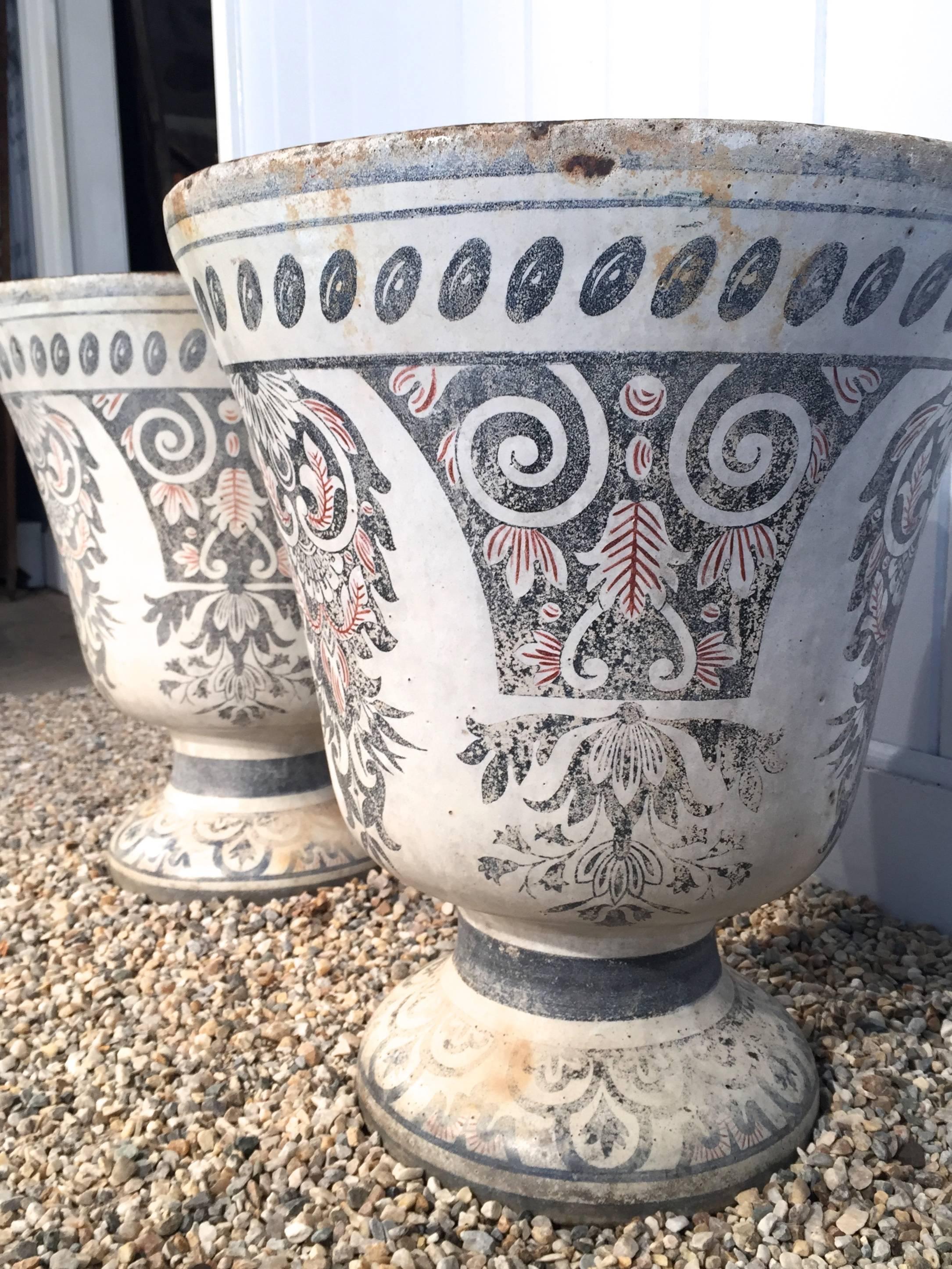 Acquired from the personal collection of Oprah Winfrey's home in Montecito, California, this rare pair of cast iron enameled Rouen vases or urns is signed E. Paris et Cie, Rue de Paradis and dates circa 1870. Fabulous condition and guaranteed