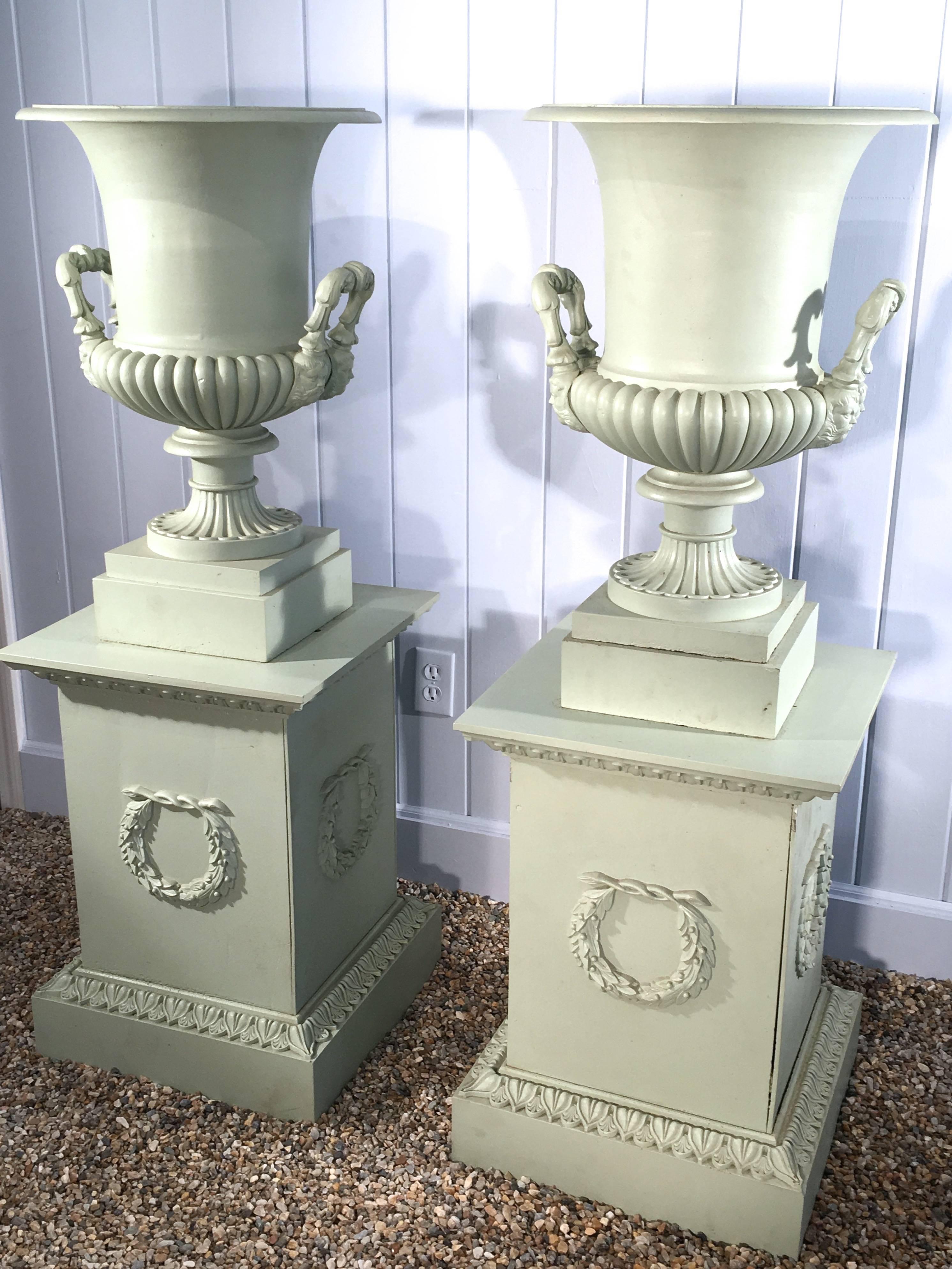 Pair of 19th Century French Cast Iron Masked Urns on Tall Plinths In Good Condition In Woodbury, CT