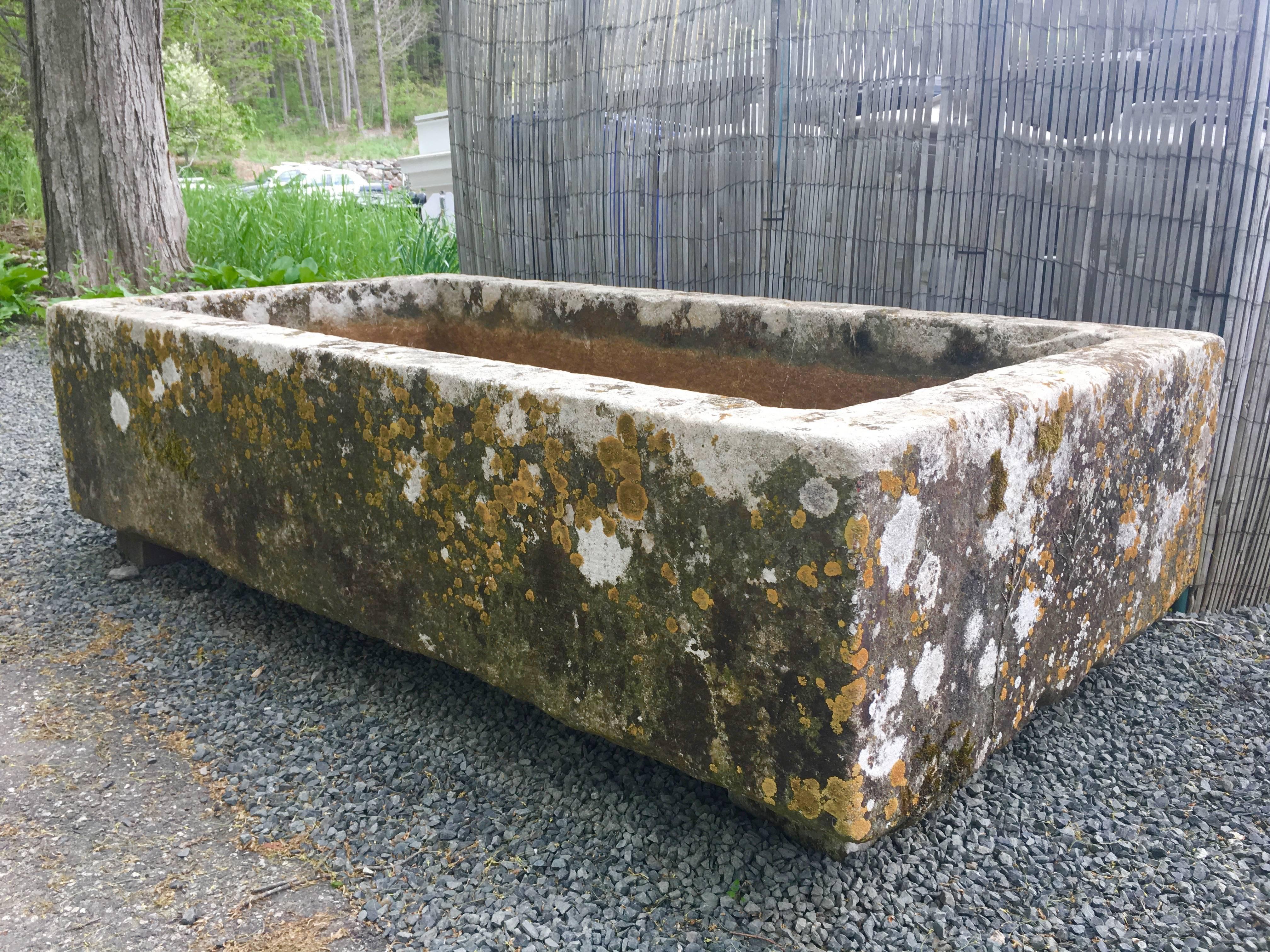 This very large hand-carved stone trough is a beauty! Its condition is impeccable and the patina is exceptional, with over 200 years of accumulated white, pale green and orange lichen. Its size and presence would make for a wonderful water feature