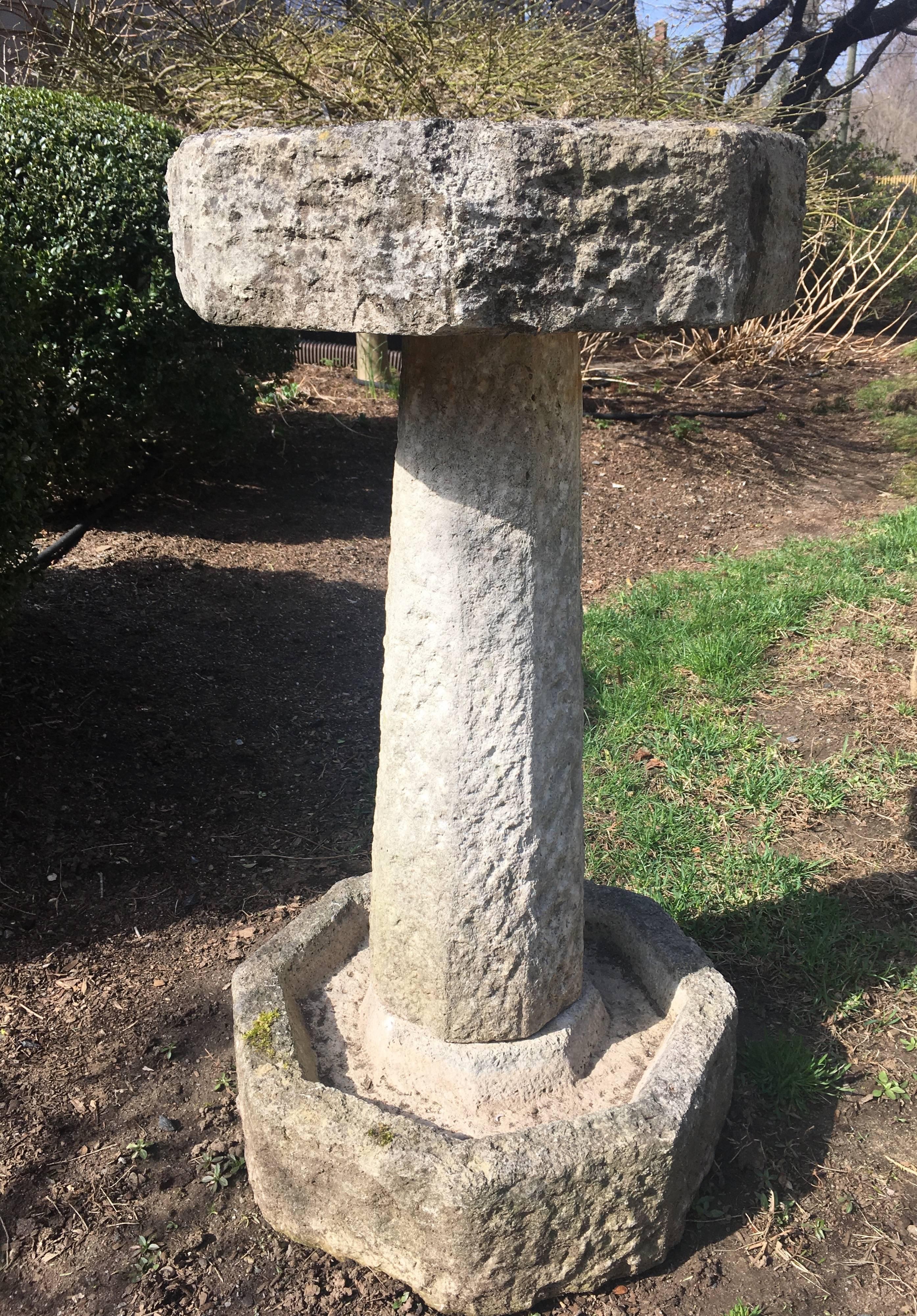 This hand-carved octagonal Purbeck stone birdbath is quite rare in that it has two drinking wells for your feathered friends. The top bowl features a centre bird perch, while the base has been configured to also accept water. In exceptional