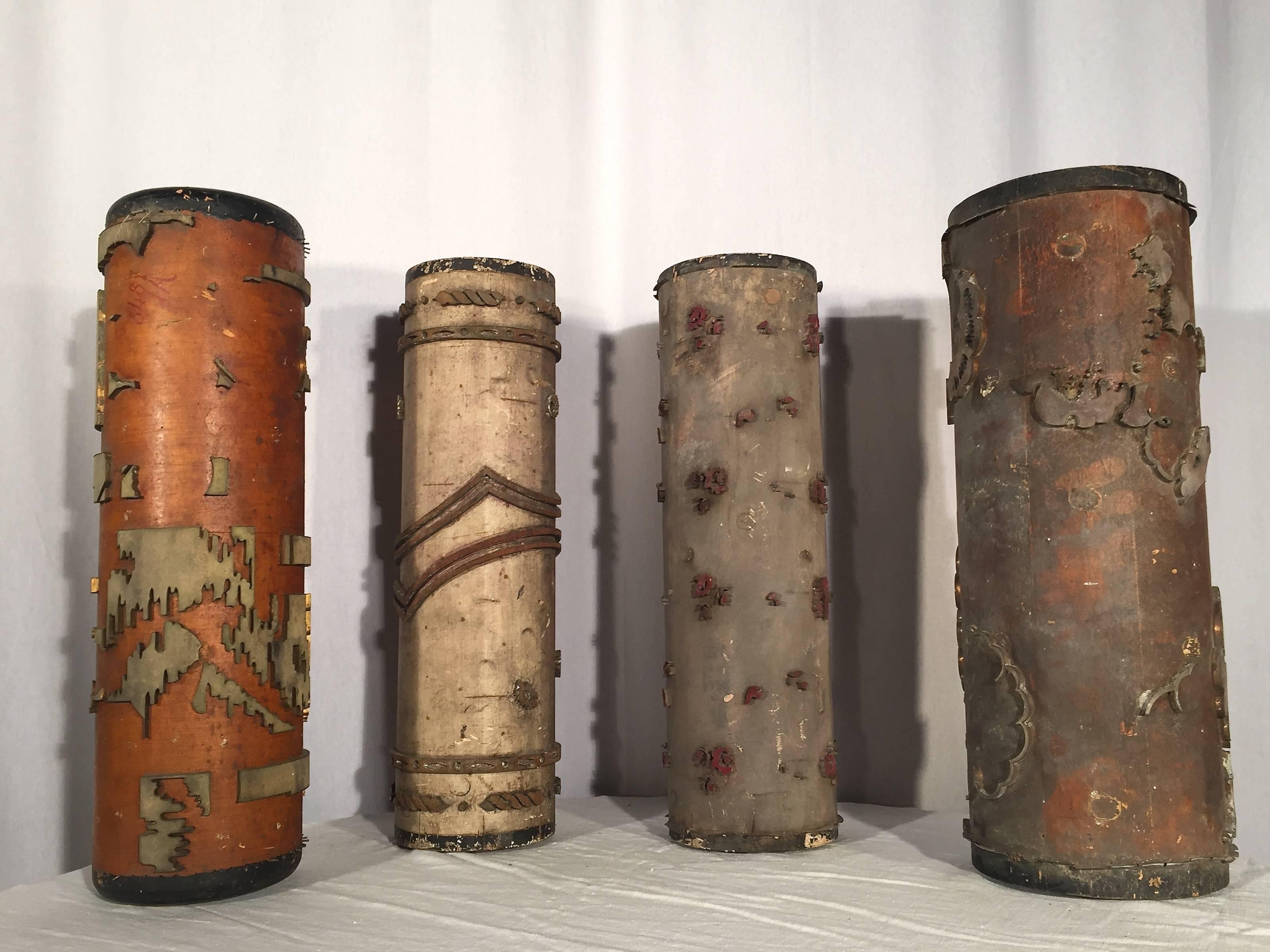 When wallpaper is printed by hand, separate rollers are made to each imprint a different color on the background. These vintage rollers from the 1930s are truly unusual and would make great lamps or sculptural elements on a mantlepiece or table.