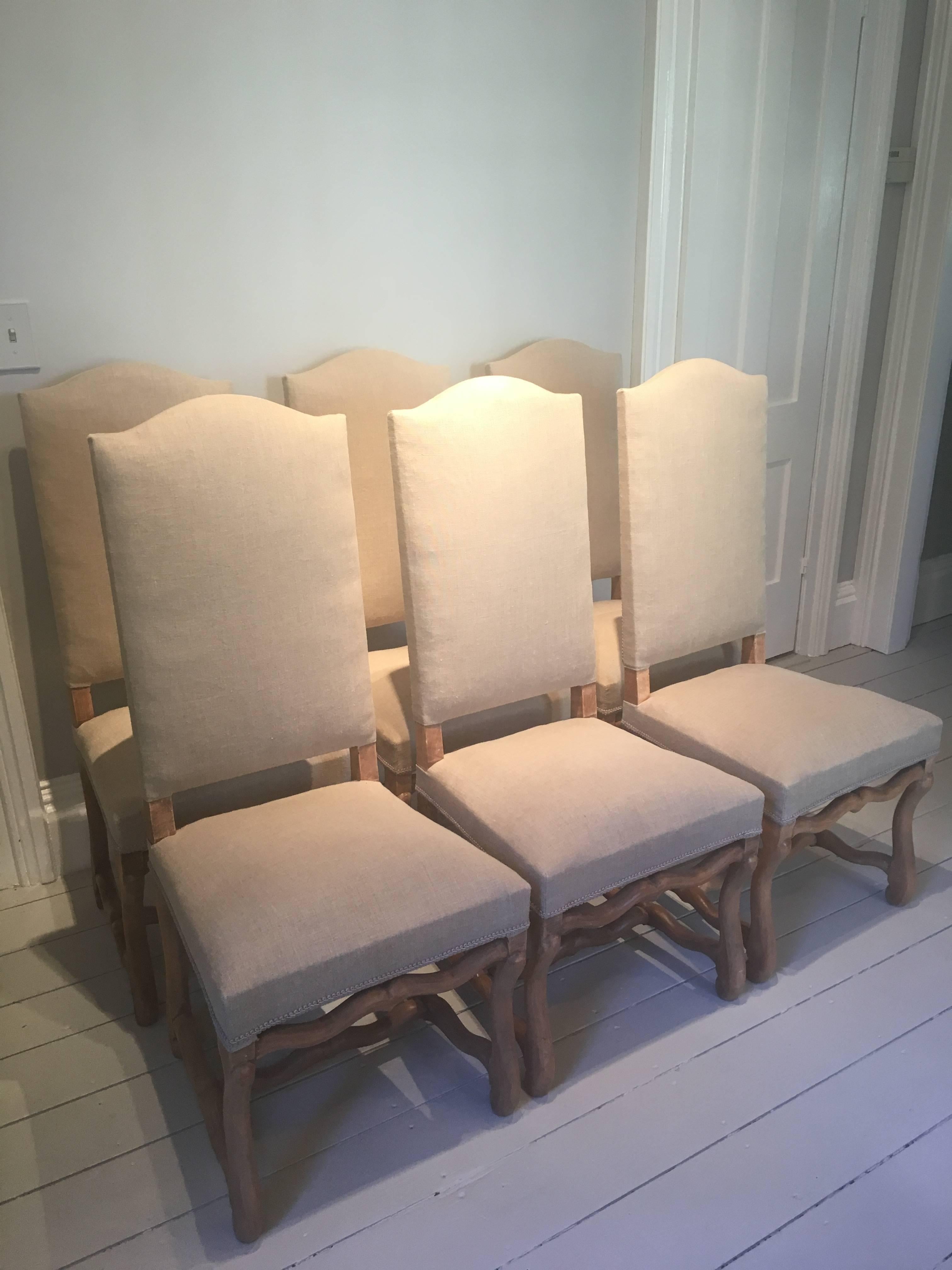 This set of six Os de Mouton chairs is all handmade from beech and dates to the late 19th century. With very desirable "Chapiteau du Gendarme" arched tops, the beech legs have been stripped and waxed to achieve a warm, pale color that is