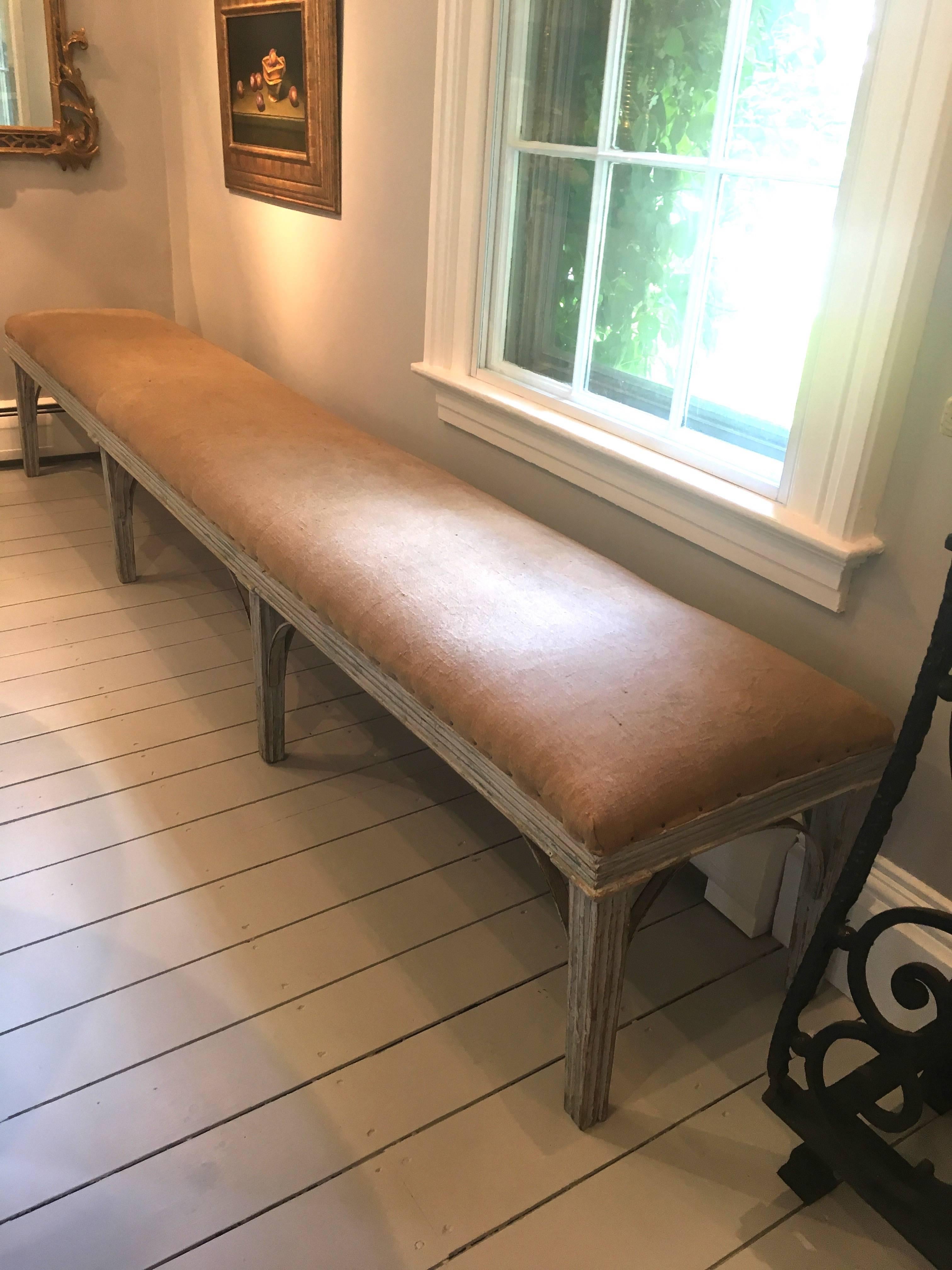 This bench is simply amazing! Crafted of pine with a reeded apron and eight reeded legs, it spans over 9 feet long and would make a superb addition to any long hallway, library or bedroom. Alternatively, it would be wonderful at a long dining table