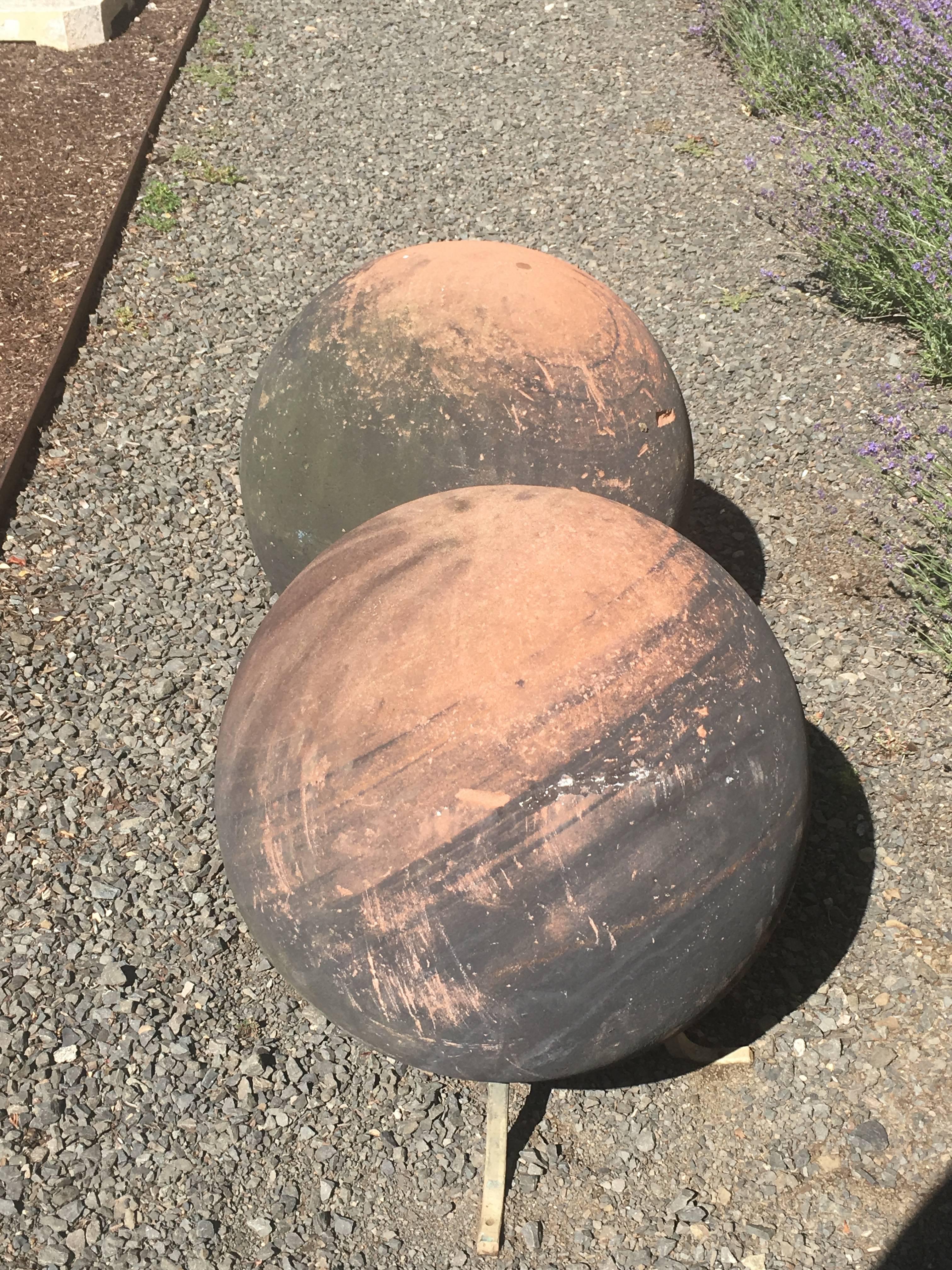 Pair of Huge English Carved Sandstone Balls on Bronze Feet In Excellent Condition In Woodbury, CT