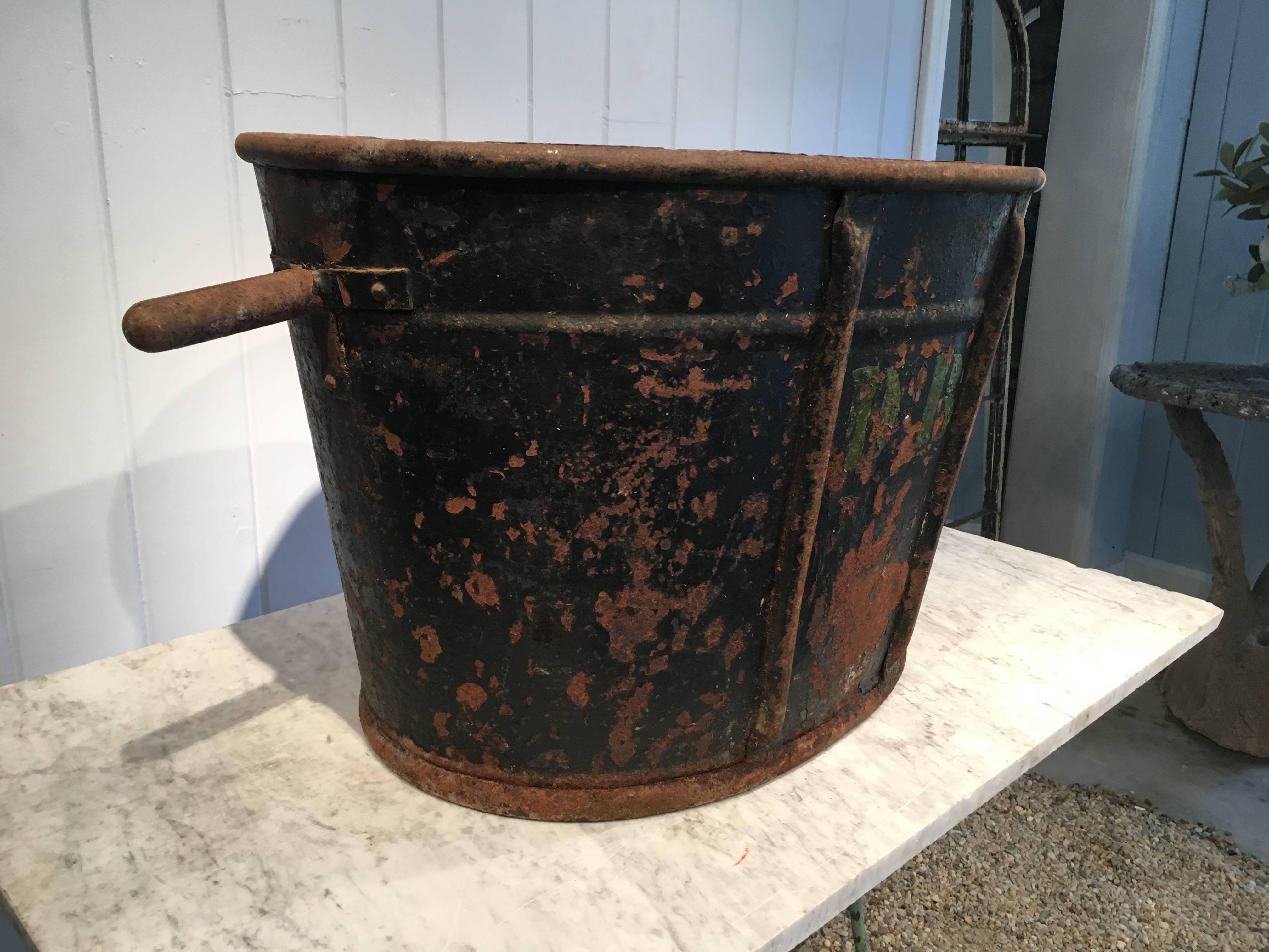 Now this grape-picker's bucket is superb! Sporting its original black paint and monogrammed "DB on one side (to identify the owner or vineyard), it would make a great ice chest for parties or look equally well as a planter or decorative piece