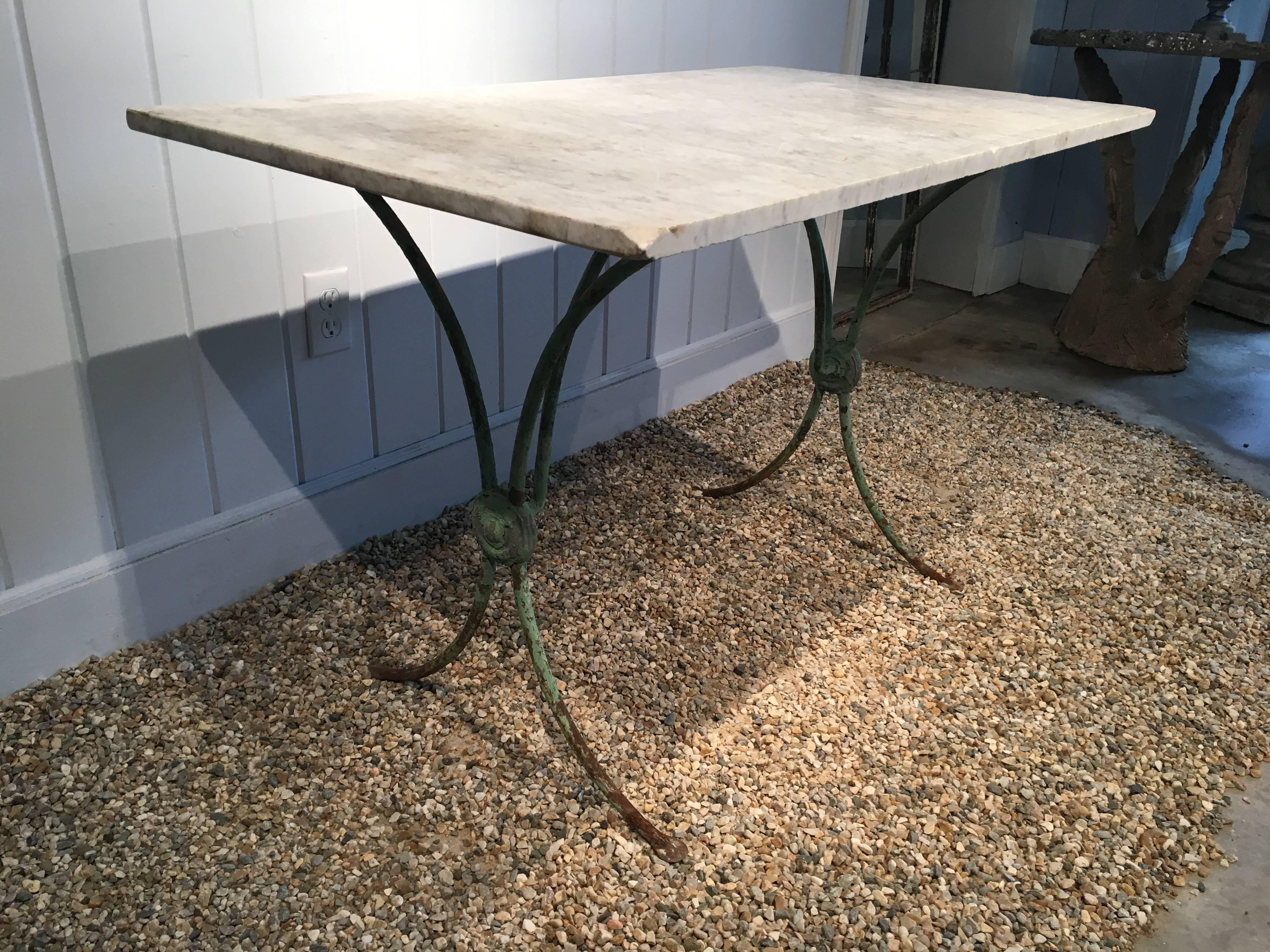 marble top wrought iron table