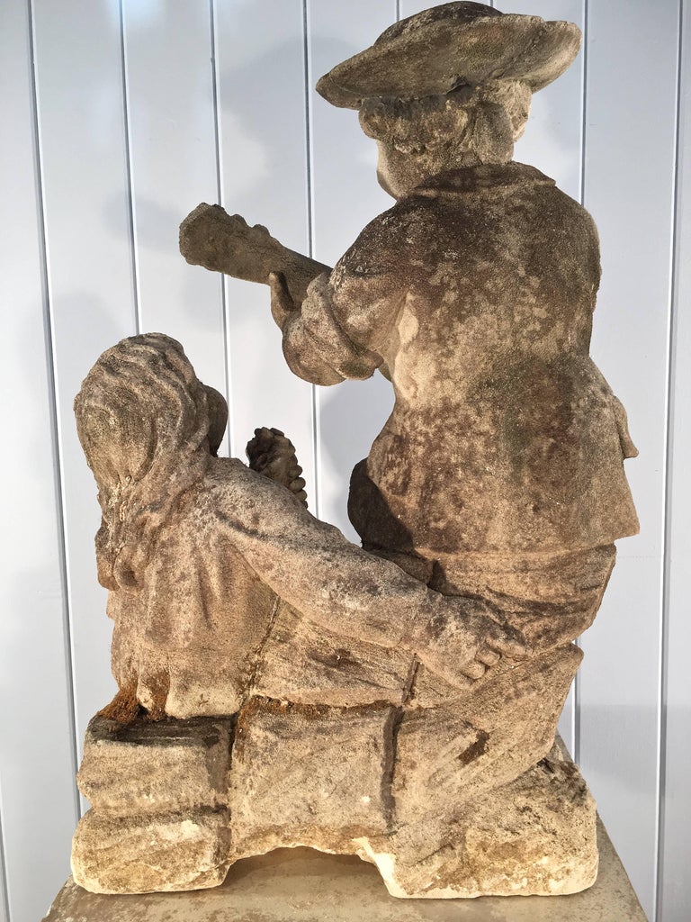 Carved Limestone Statue of Children on Tall Pedestal For Sale at 1stdibs
